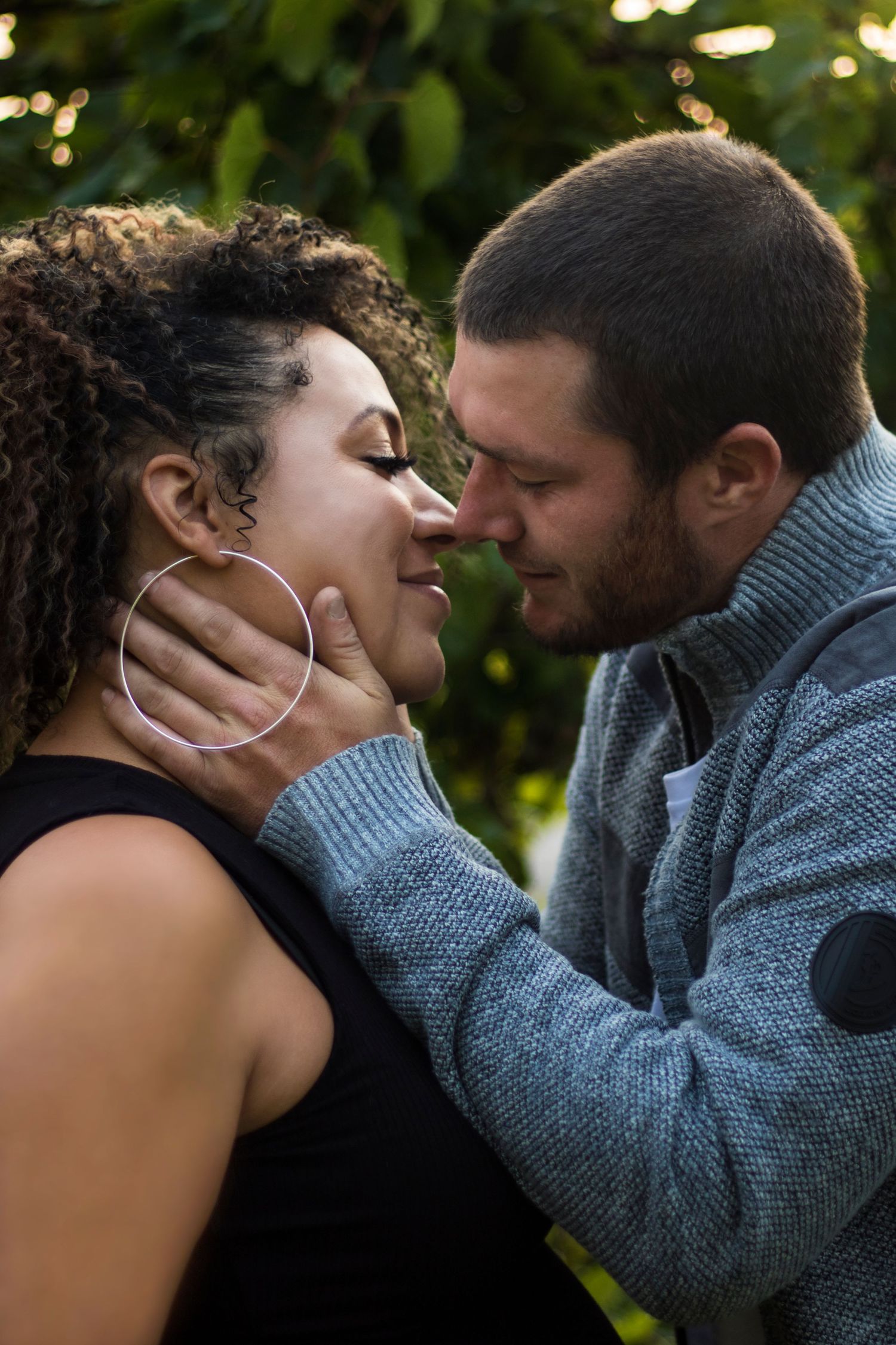 A romantic sequence of intimate moments captured in an outdoor setting.