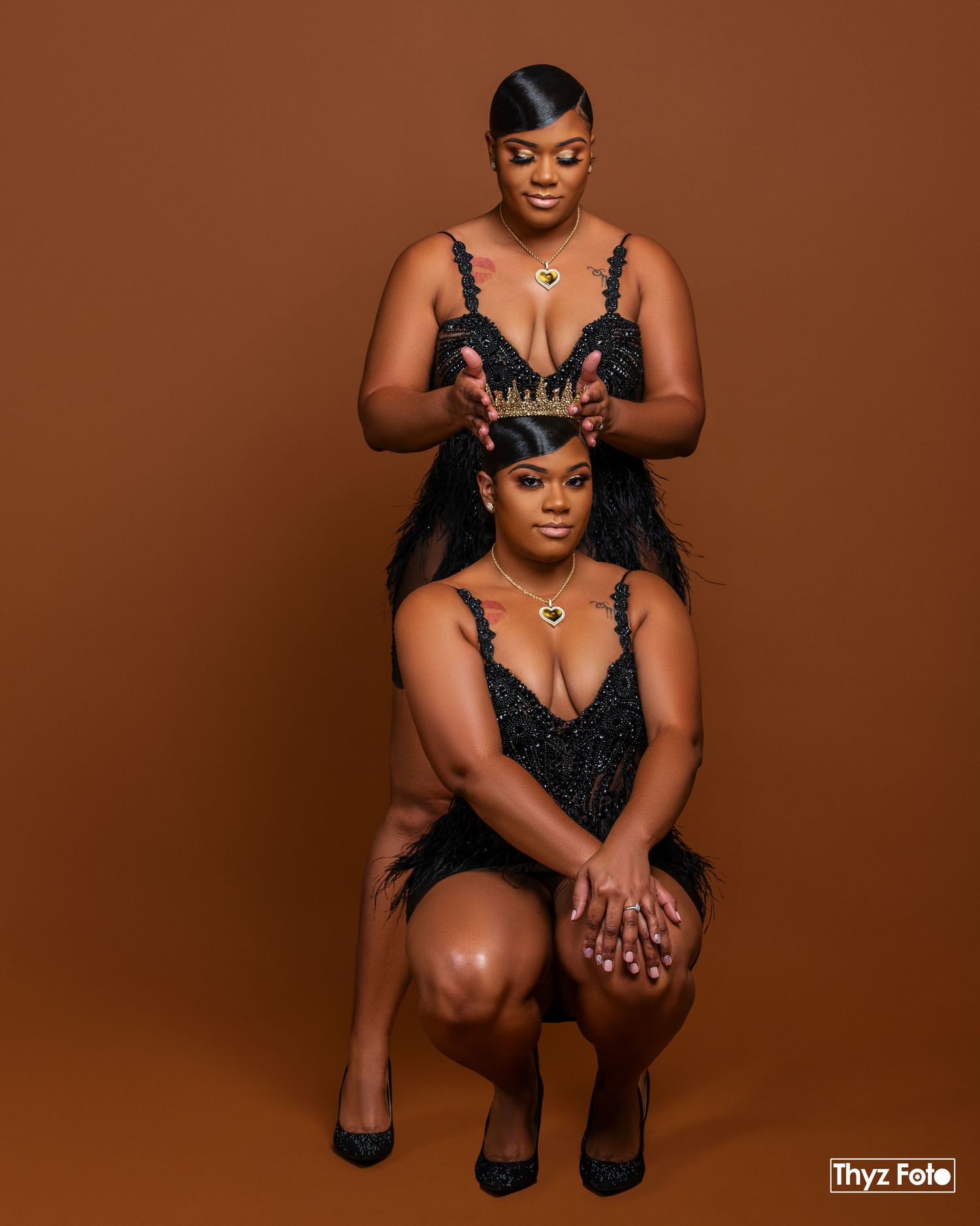 High-fashion maternity photography featuring a stylish mother-to-be in a bold brown setting.