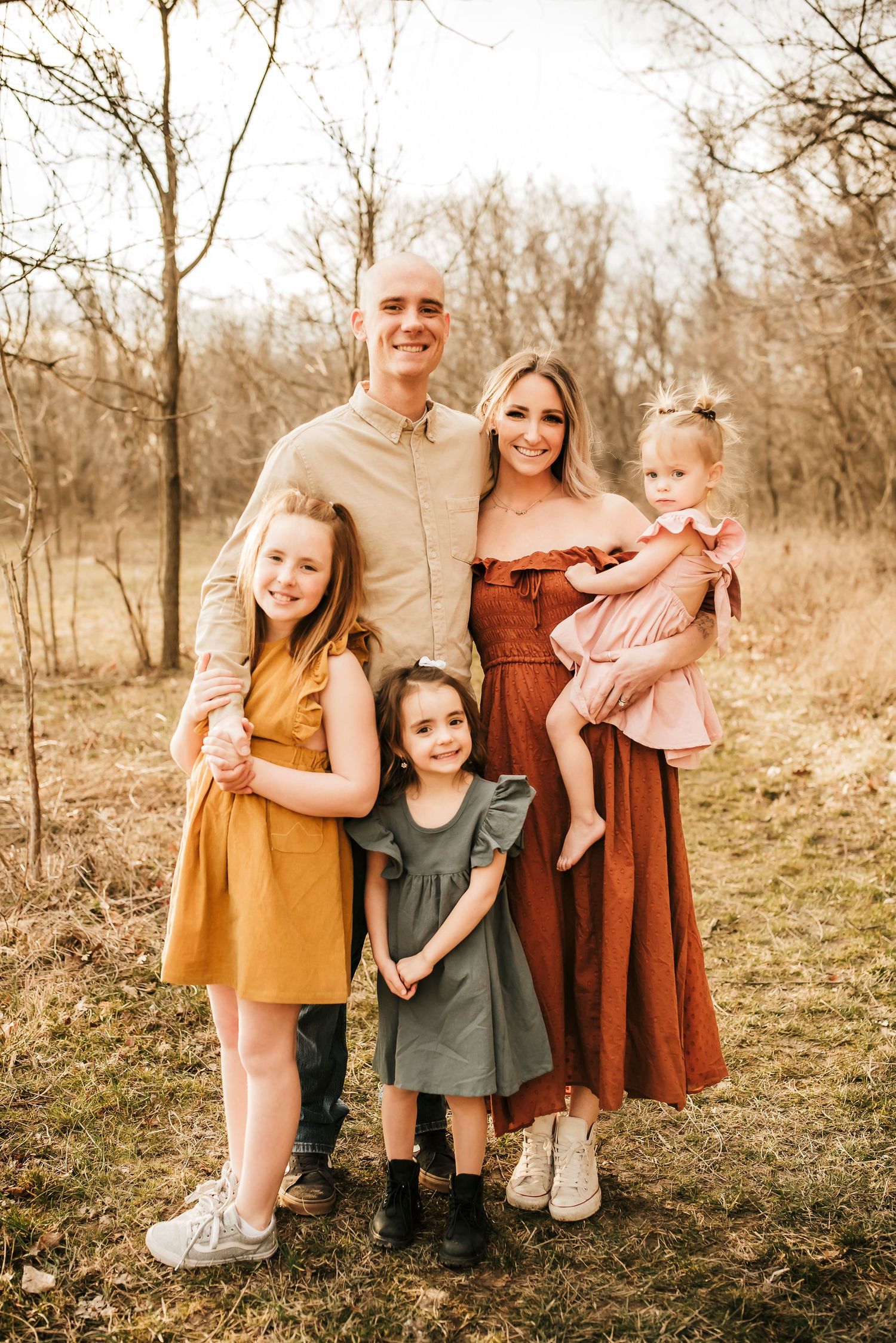 picture perfect family of five wearing matching outfits for fall family photos