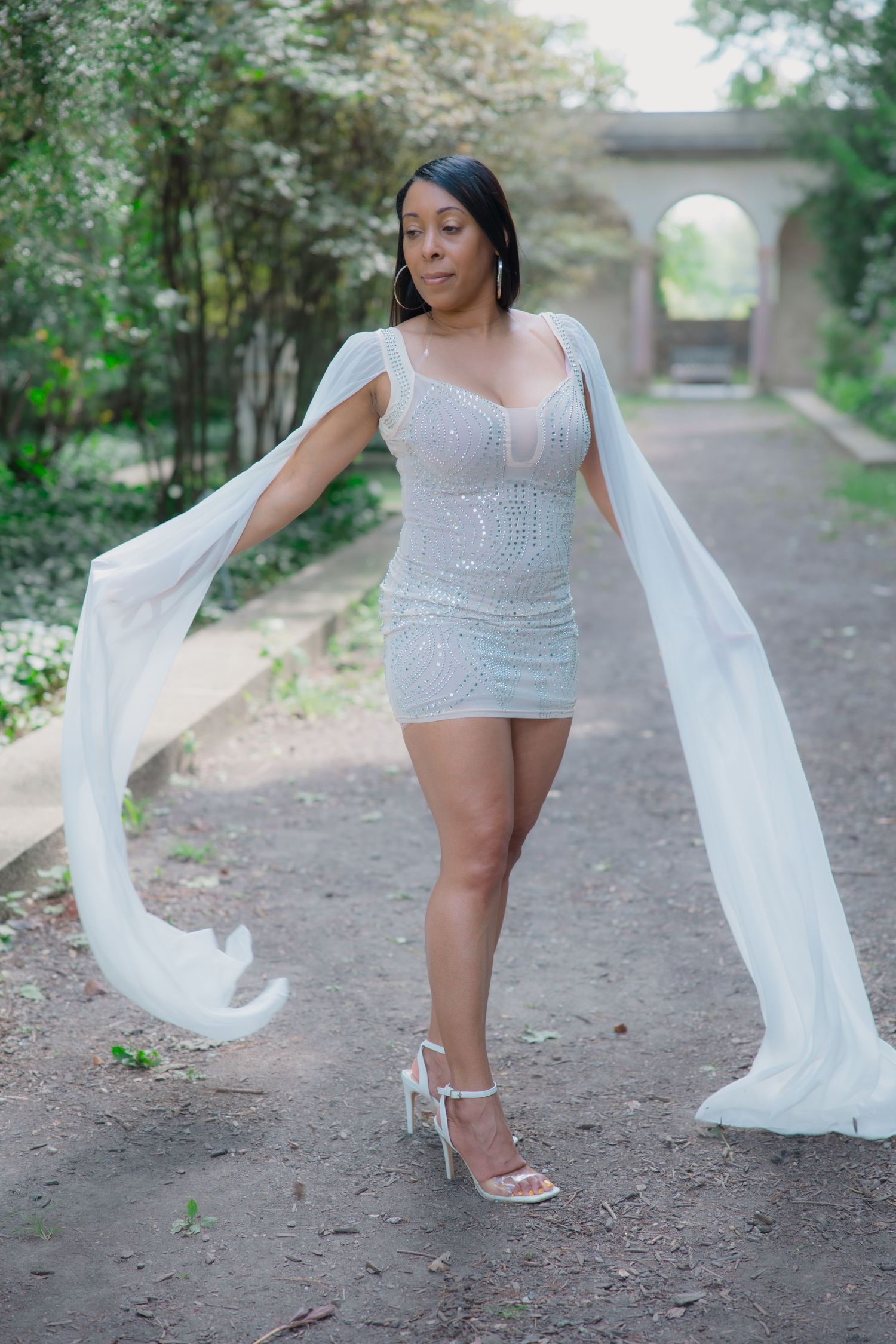 Elegant poses with flowing white fabric on a natural wooded path.  L Visions Photography. Lifestyle photoshoot.