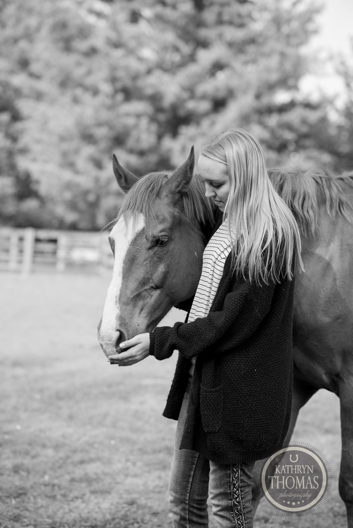 An intimate black and white portrait of a horse and companion sharing a quiet moment.