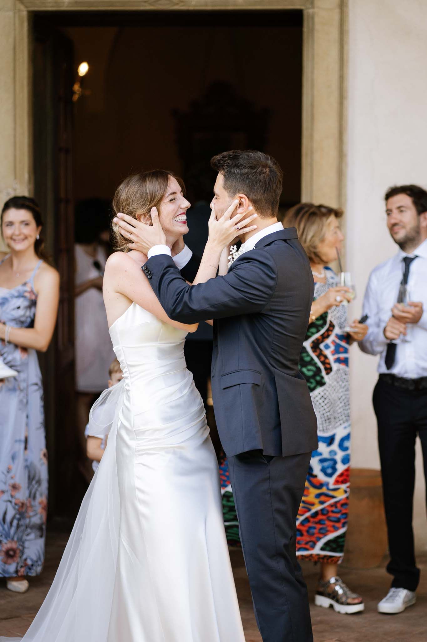 Tender moment between newlyweds sharing an intimate embrace during their reception.