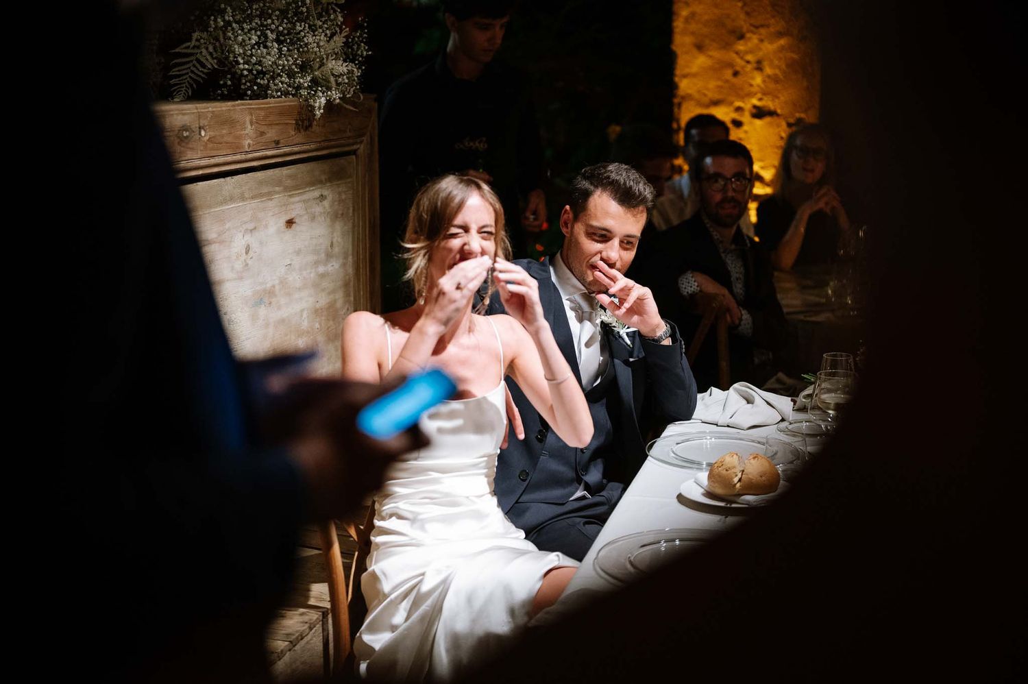 Couple sharing an intimate moment during their wedding reception.