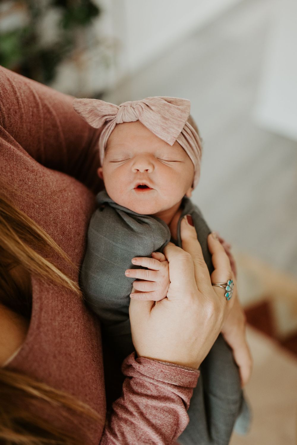 A newborn baby during their lifestyle newborn photo session in Colorado