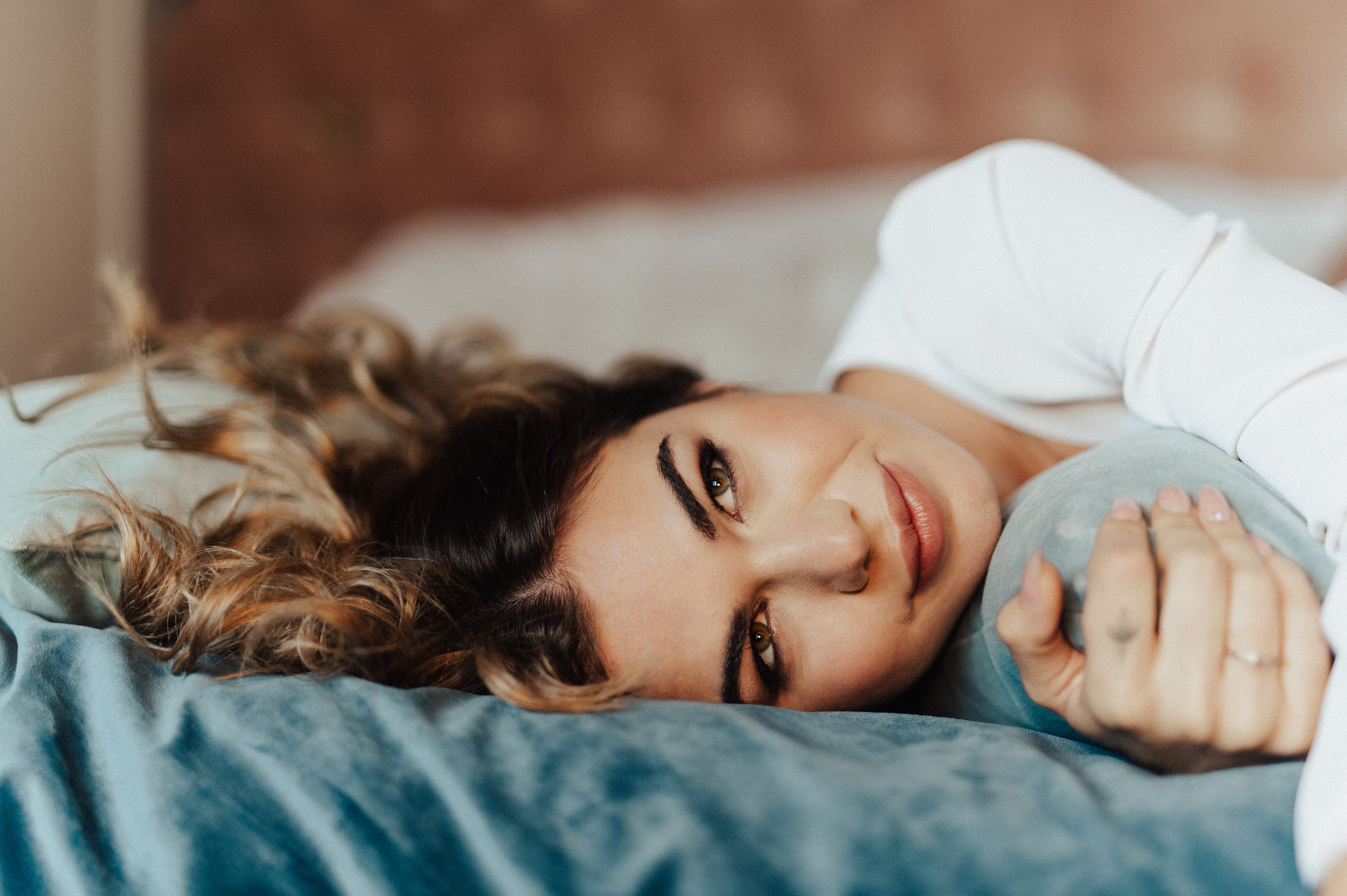 Romantic bedroom photo sequence with soft lighting and luxurious bedding.
