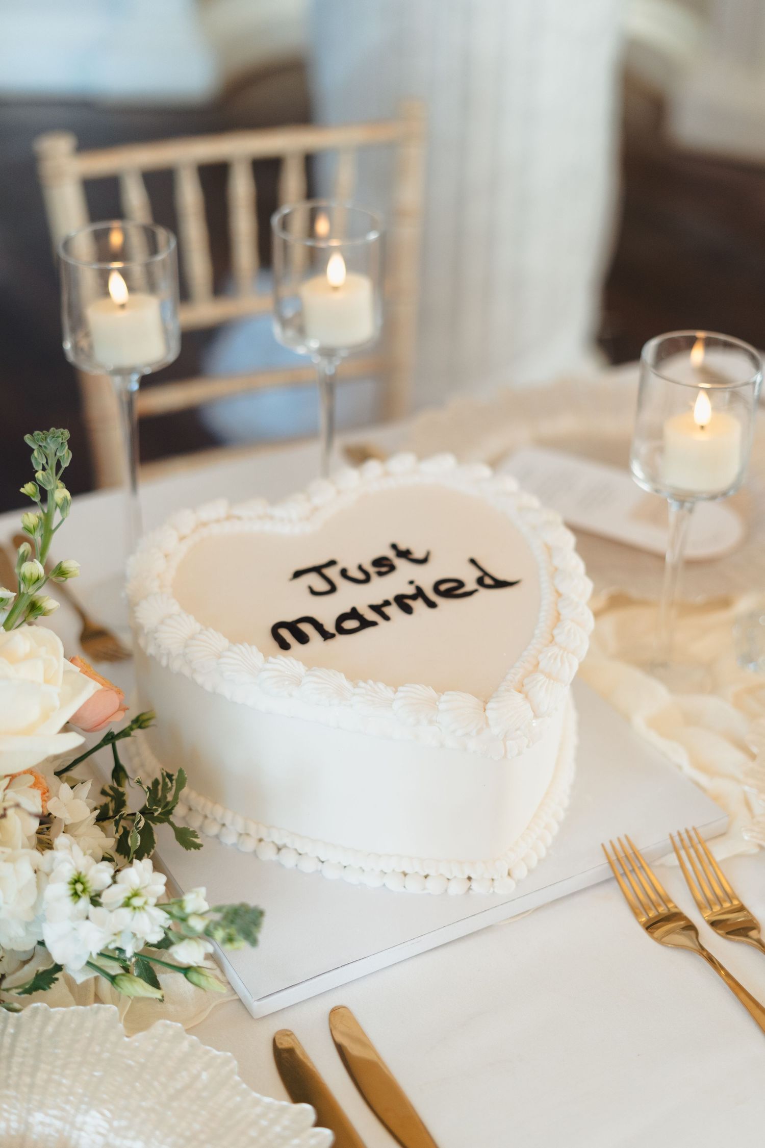 Heart-shaped just married wedding cake idea, Emilia Czarnota Photography Yorkshire wedding photographer