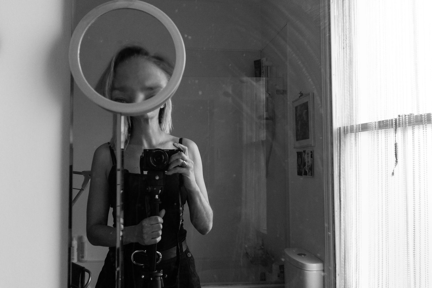 self portrait of Brighton photographer looking in the mirror