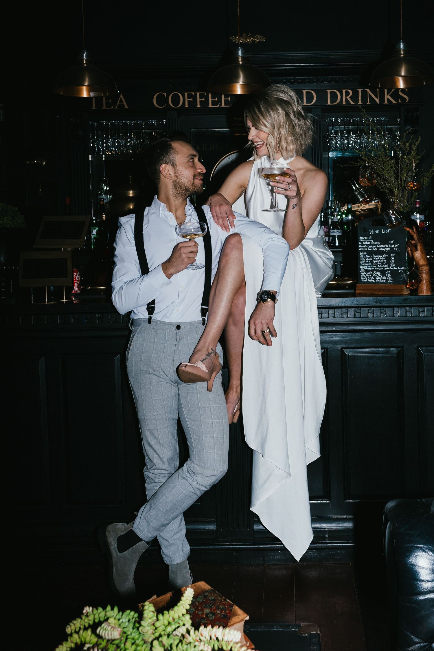 Quirky cool elopement photography. Couple eating pizza  at Wellington house in Ayrshire
