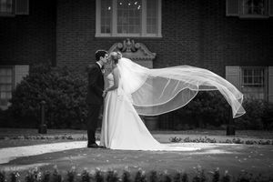 Bride and groom with flying veil wedding portrait at Brrantwyn