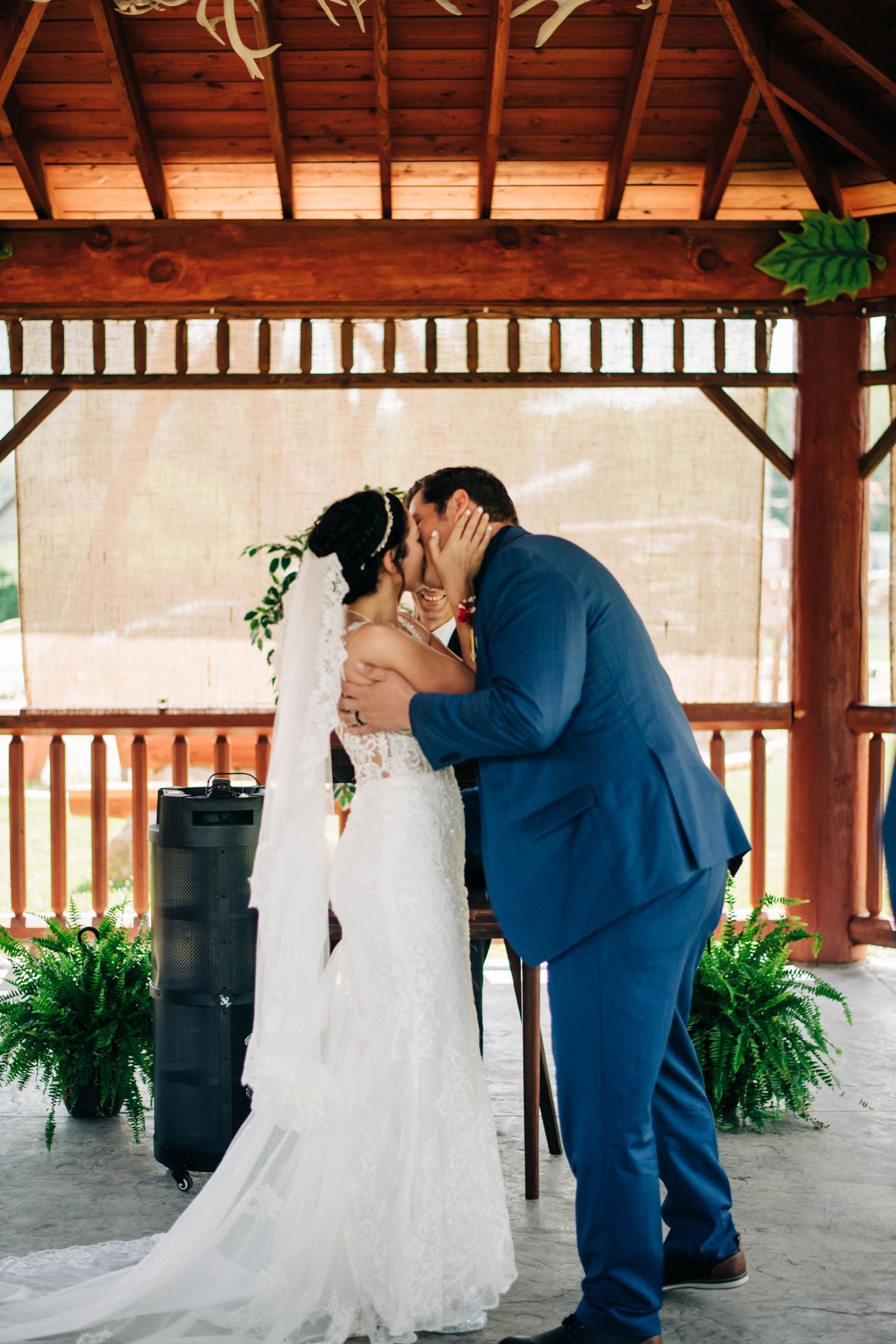 bride and groom's first kiss at their wedding