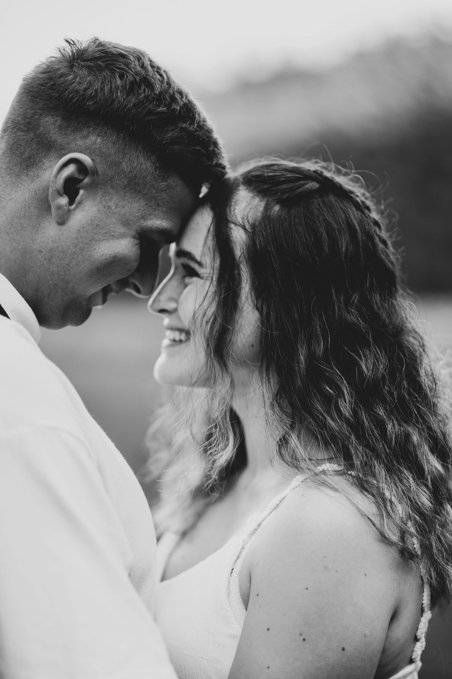 Romantic black and white portraits showing tender moments between a couple.
