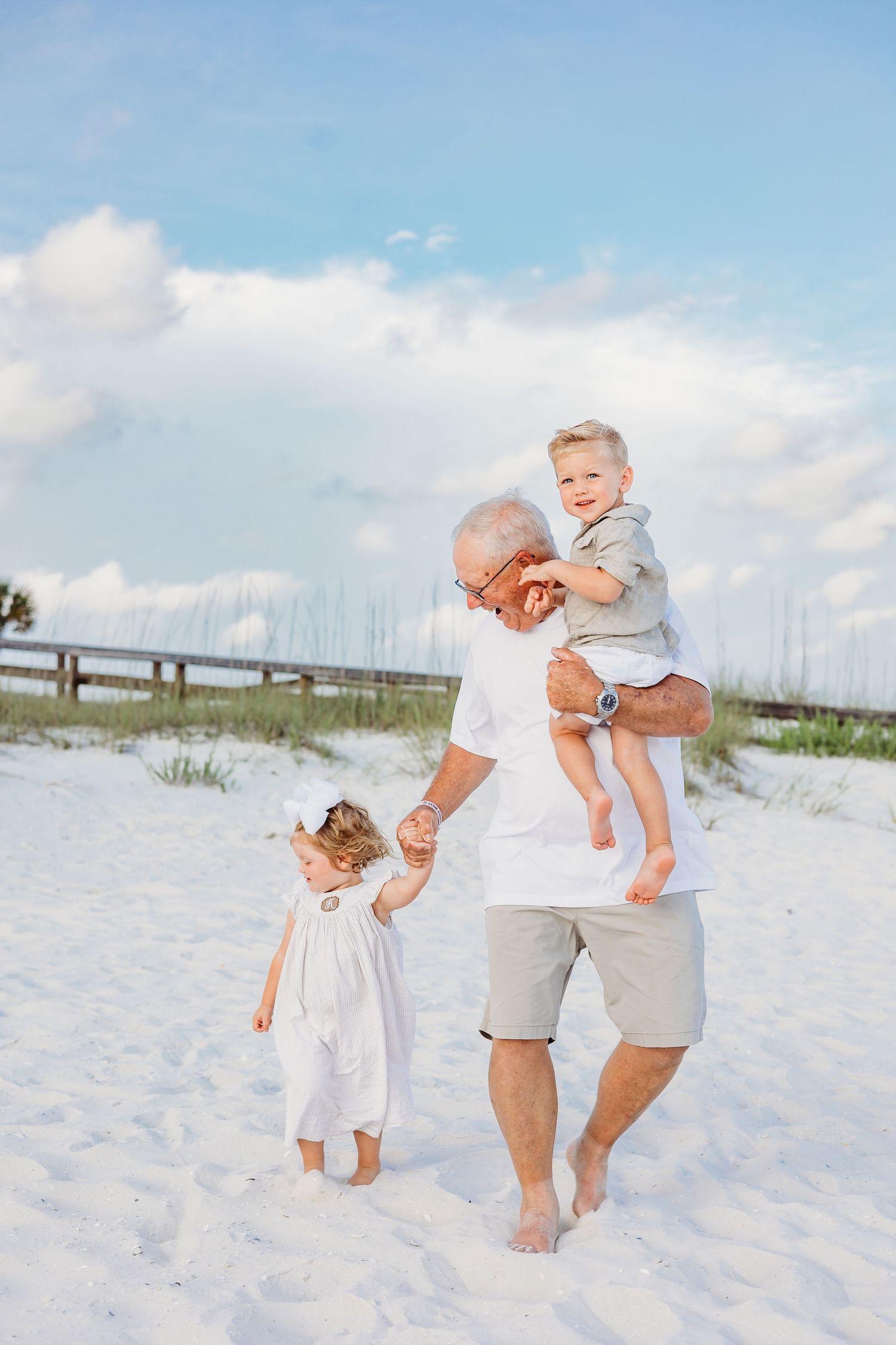 Candid beach photography capturing joyful family moments in natural light.