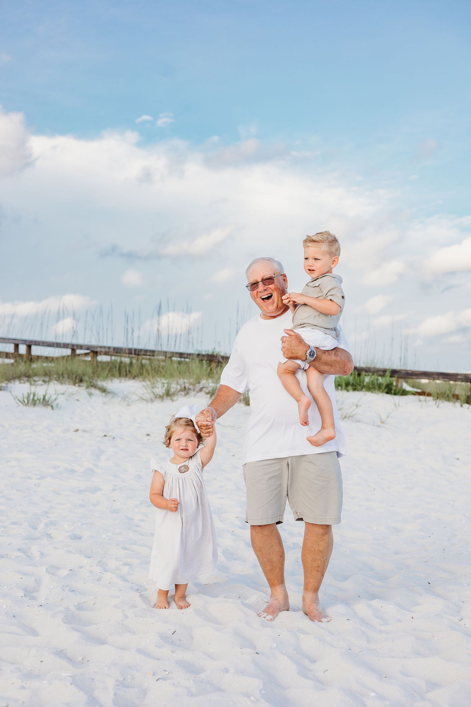 Energetic family beach portraits showing movement and joy against coastal backdrop.