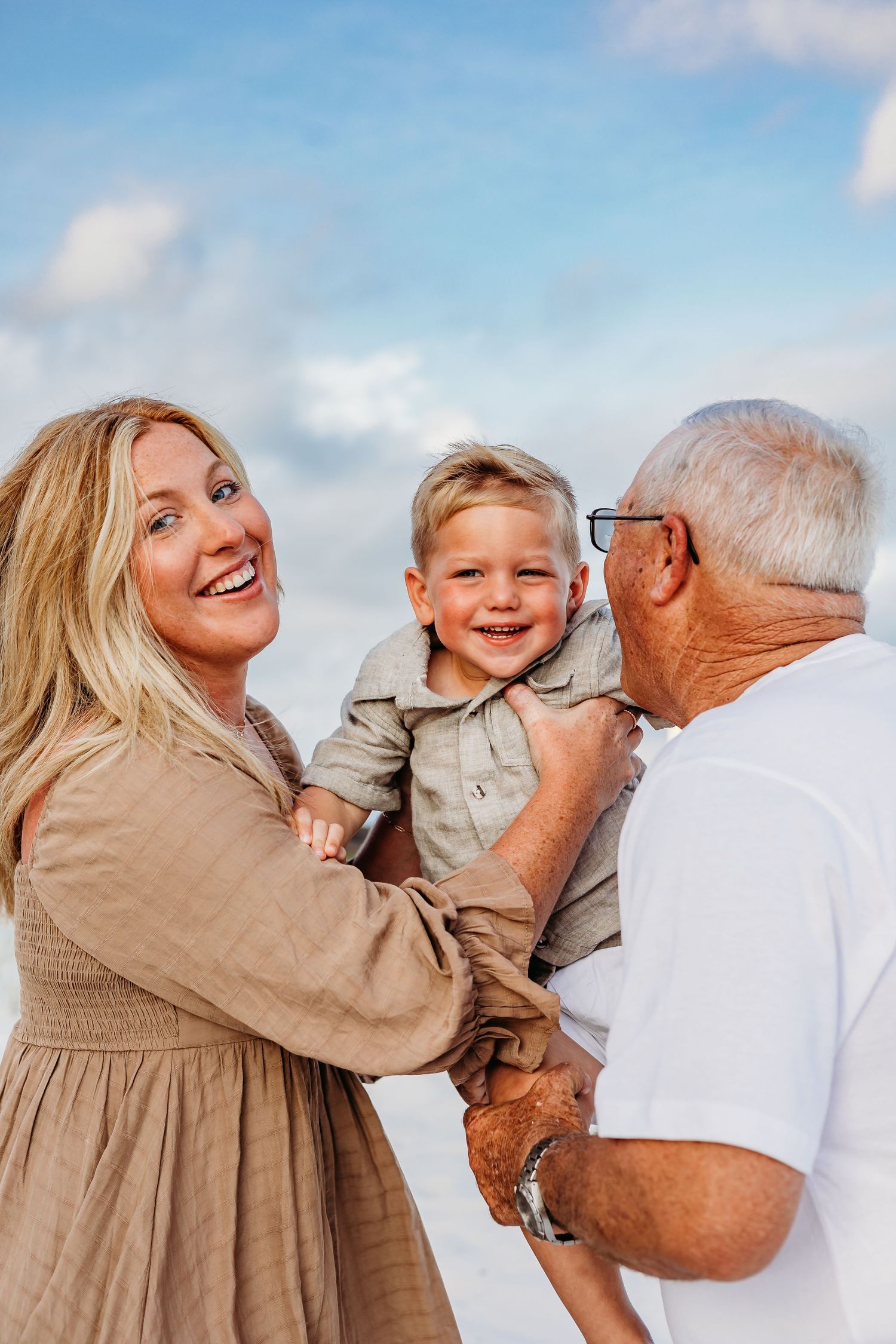 Candid family photos showing genuine laughter and affection at the beach.