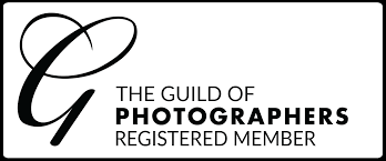 Official logo design for The Guild of Photographers showing text and registered member status in black and white.