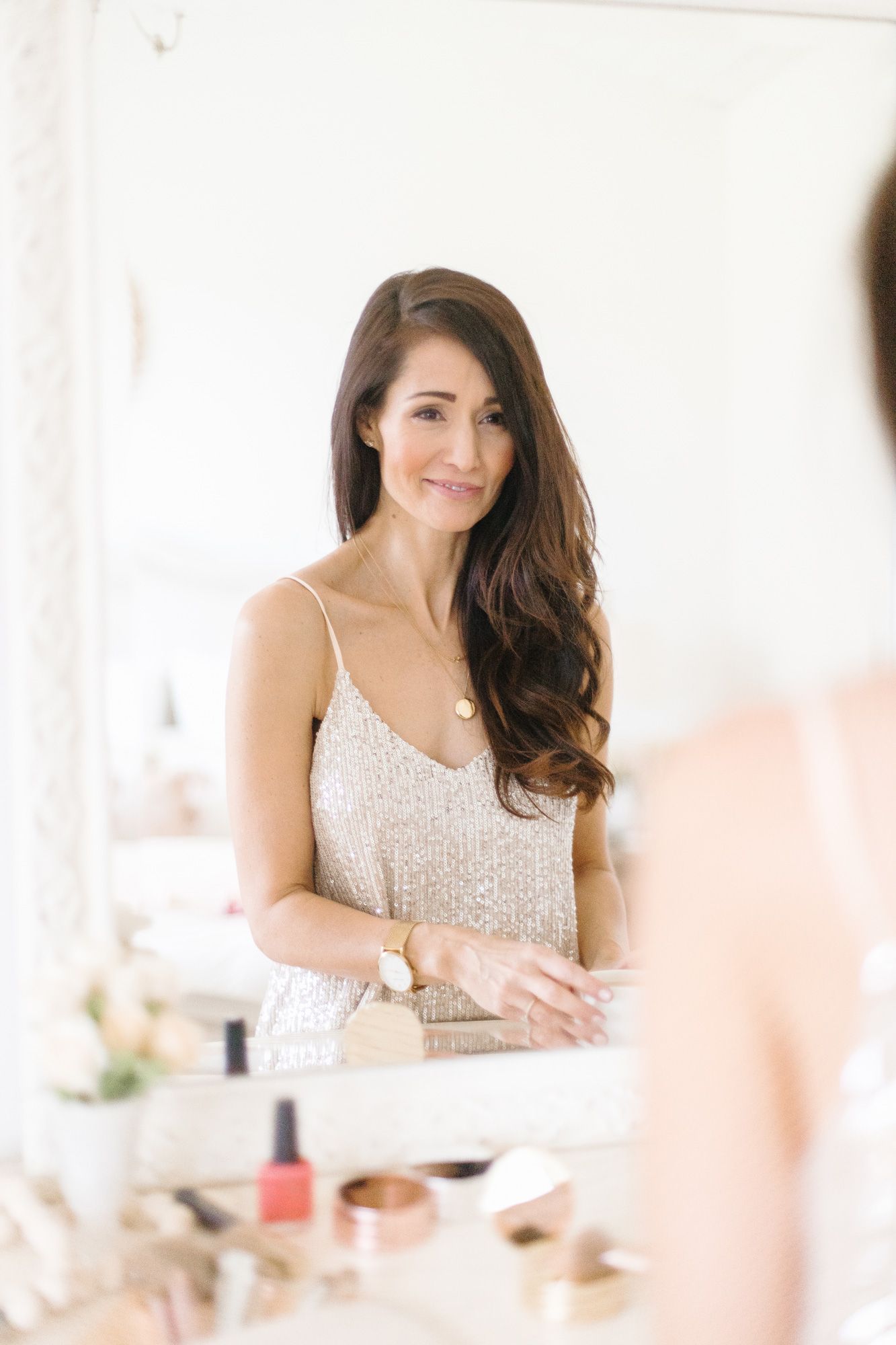 Elegant boudoir photography session with soft lighting and feminine styling.