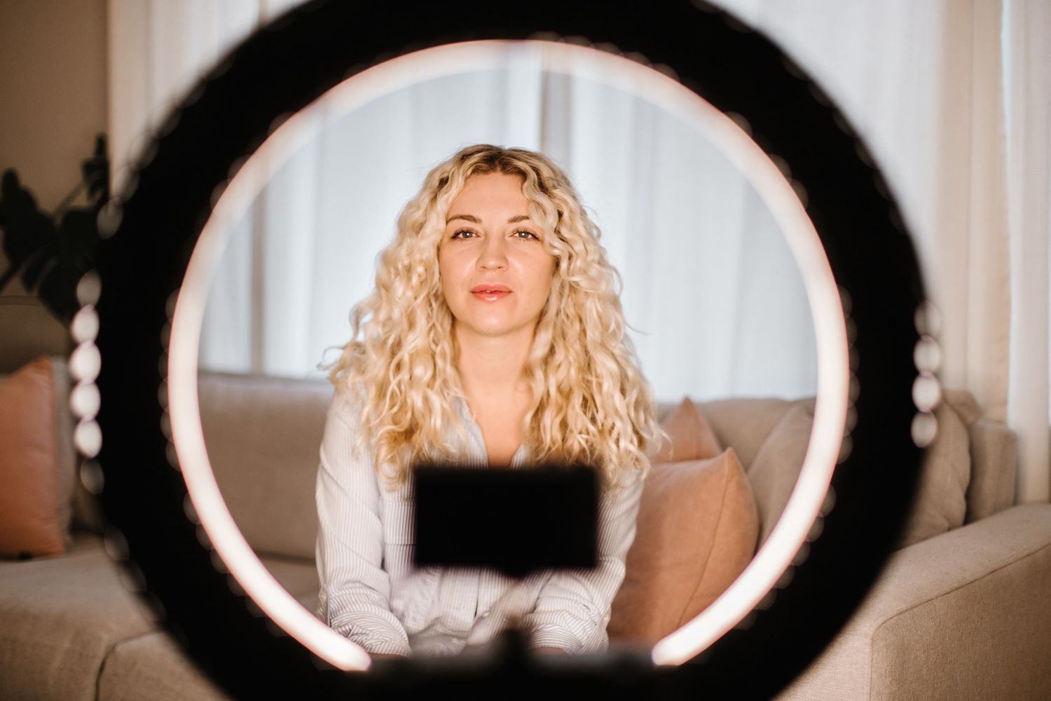 Interior view through circular mirror frame in modern home setting.