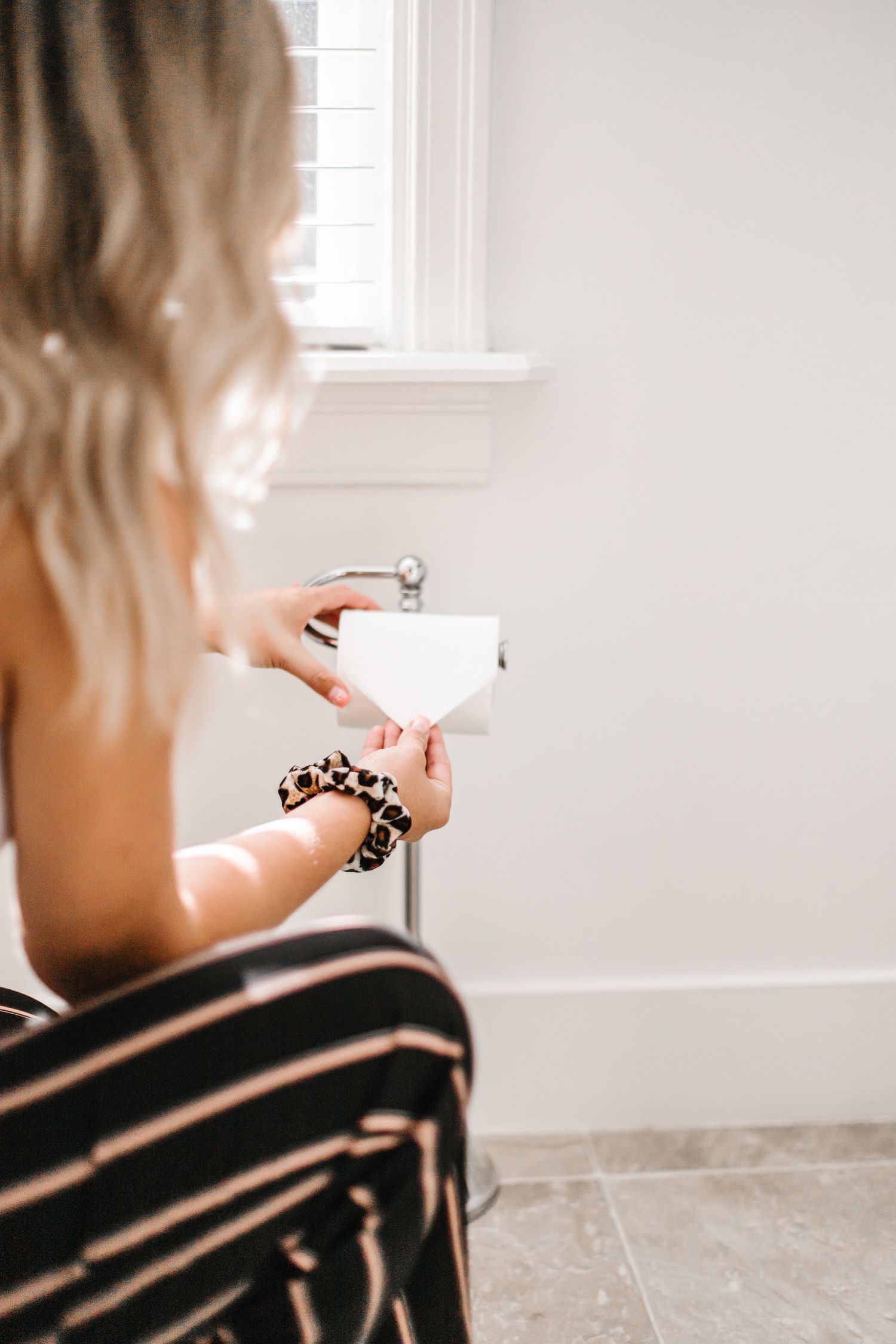 Casual indoor scene with soft natural lighting through windows.