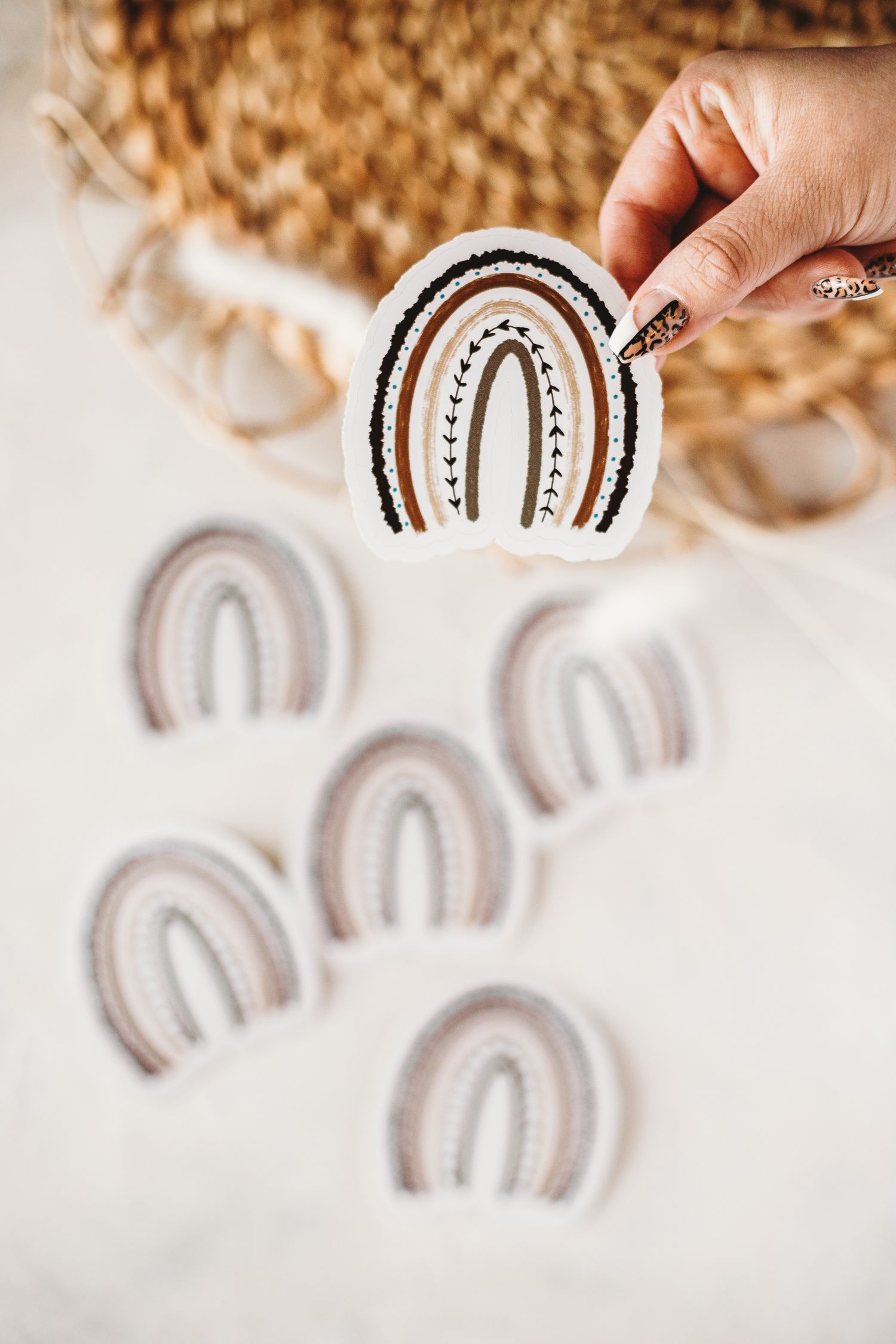 Boho-style rainbow ceramic decorations in neutral tones against white background.
