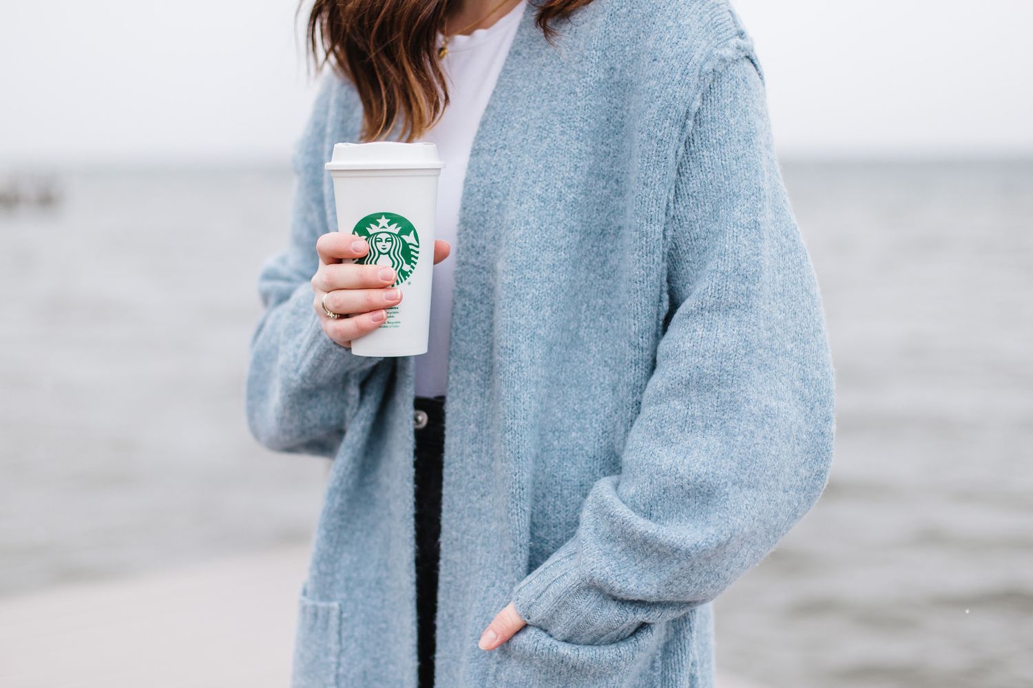 Cozy blue sweater detail against neutral background.