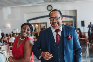 Wedding guests share a joyful moment during celebration festivities.