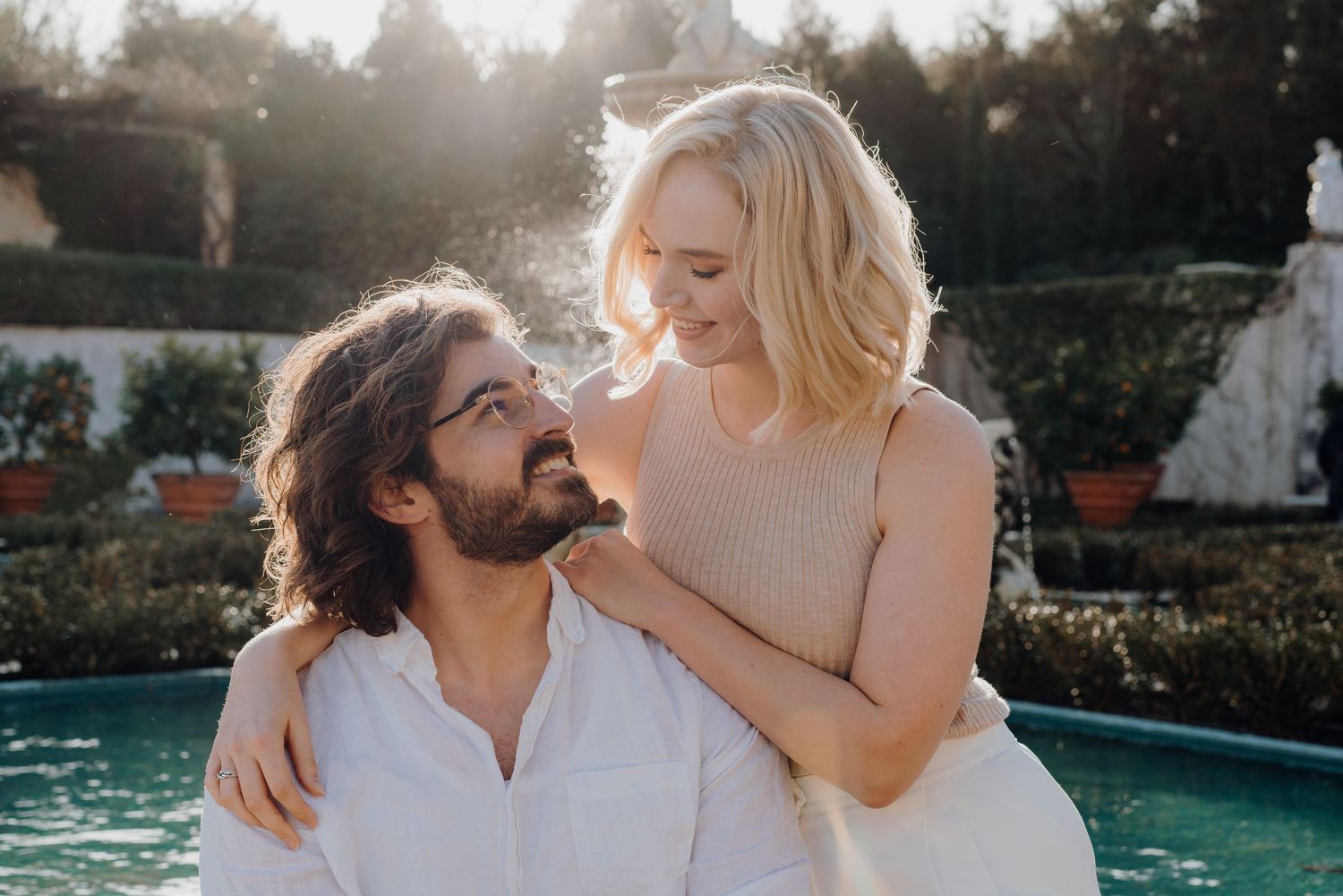 Couple laughing and smiling at each other during couple photoshoot