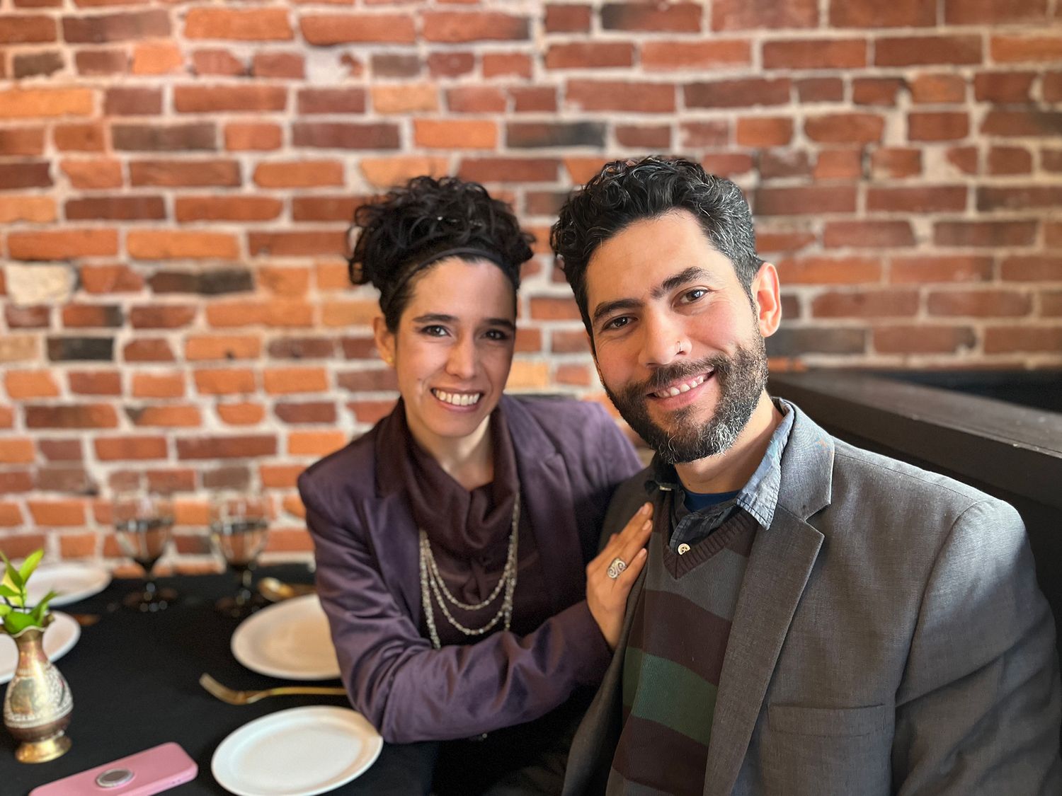 Medium Shot of Kingston Photographer and a female