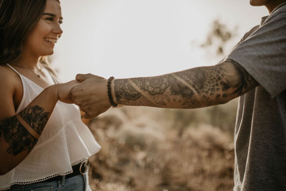 Couple holding hands on hill in Mount Isa