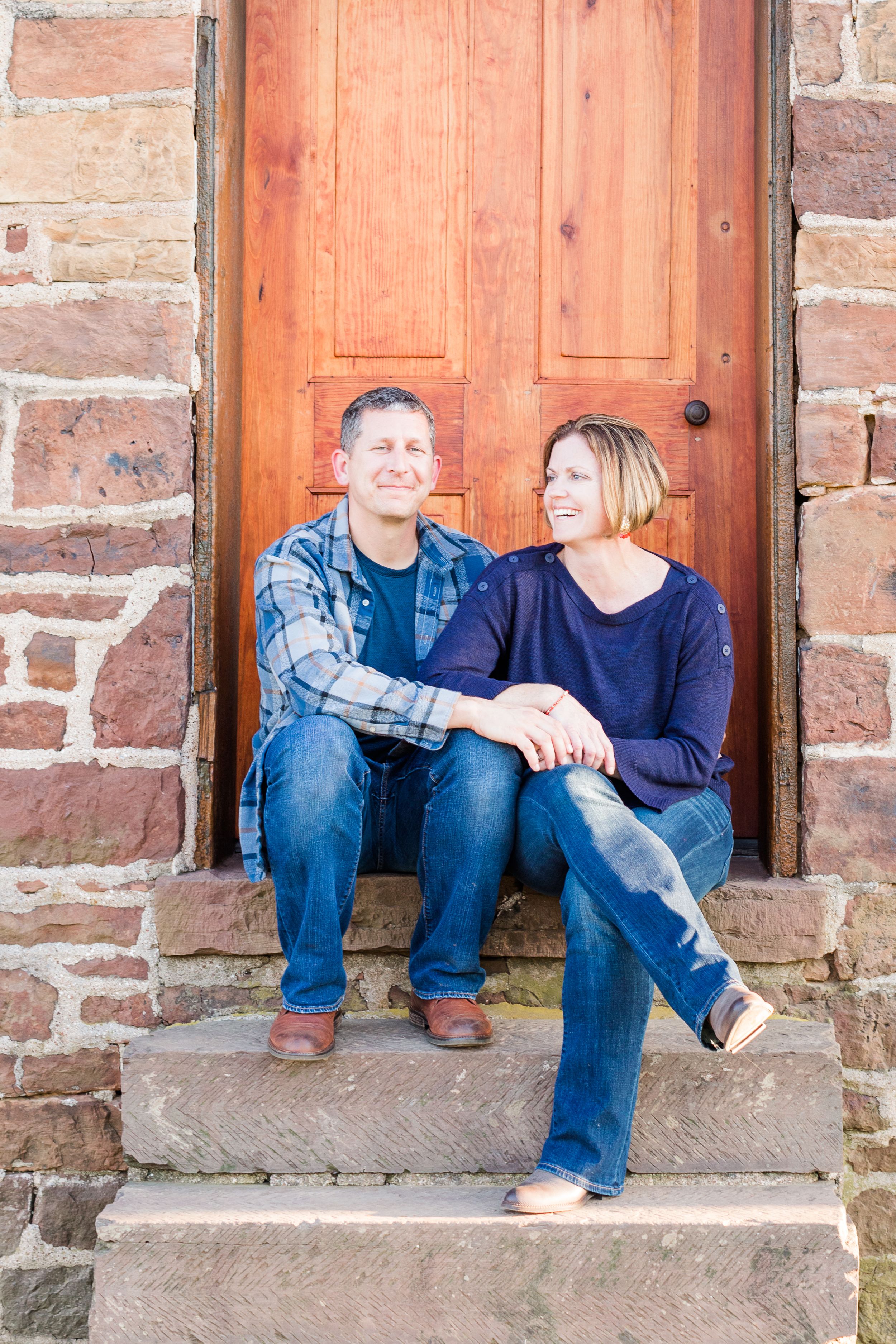 Couple posing on steps at Stone House at Manassas Battlefield