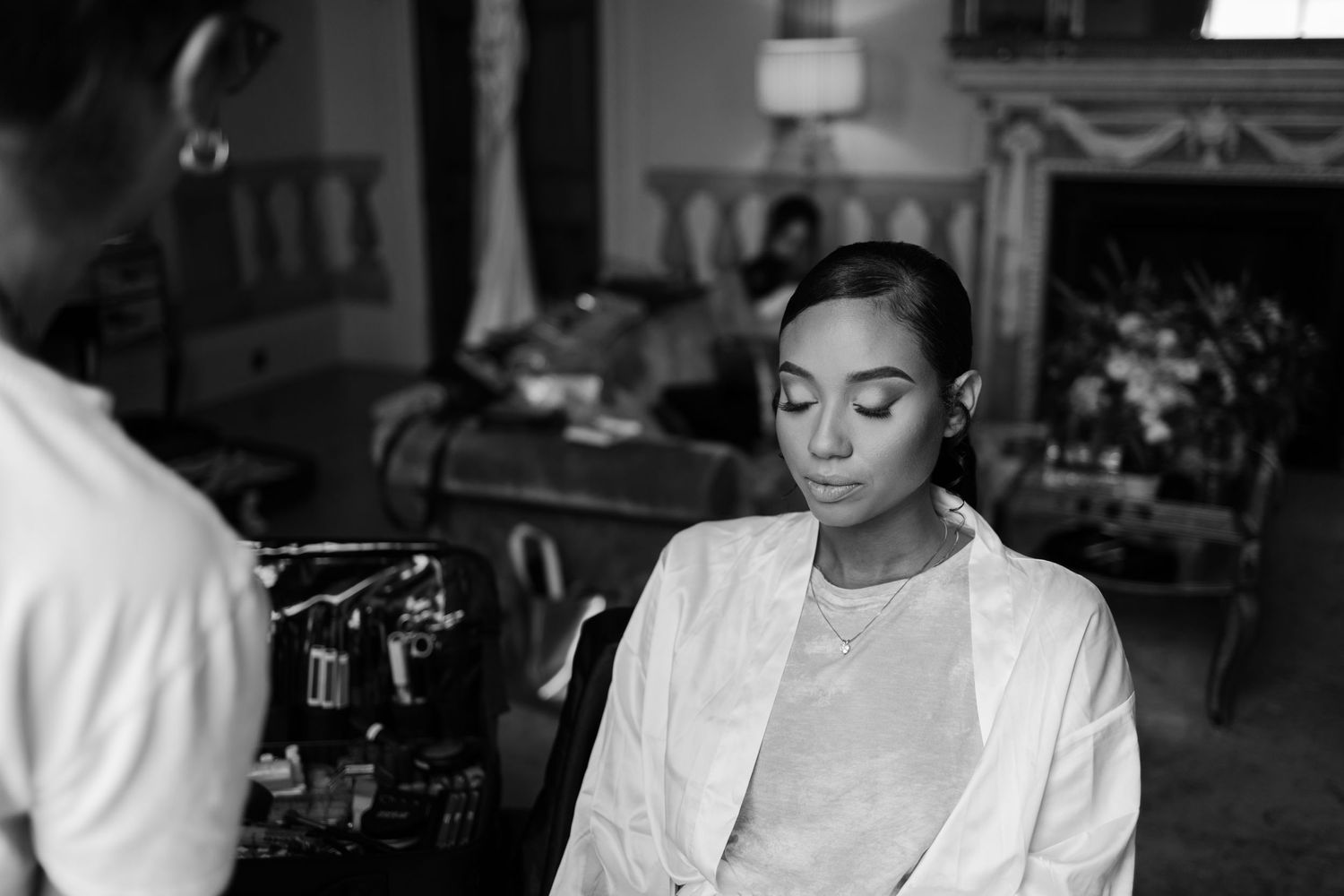 Black and white photo of preparation scene with soft lighting.