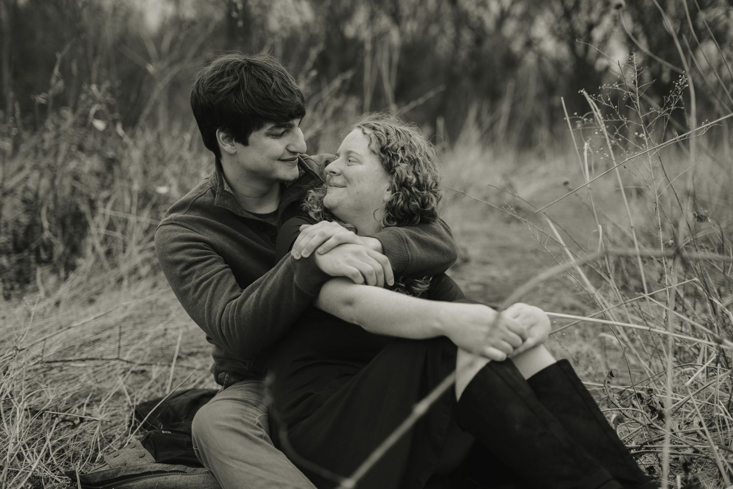 Couple Shoot - Jake and Emily sitting in a Milkweed Conservatory at Picnic Point in Madison, Wisconsin