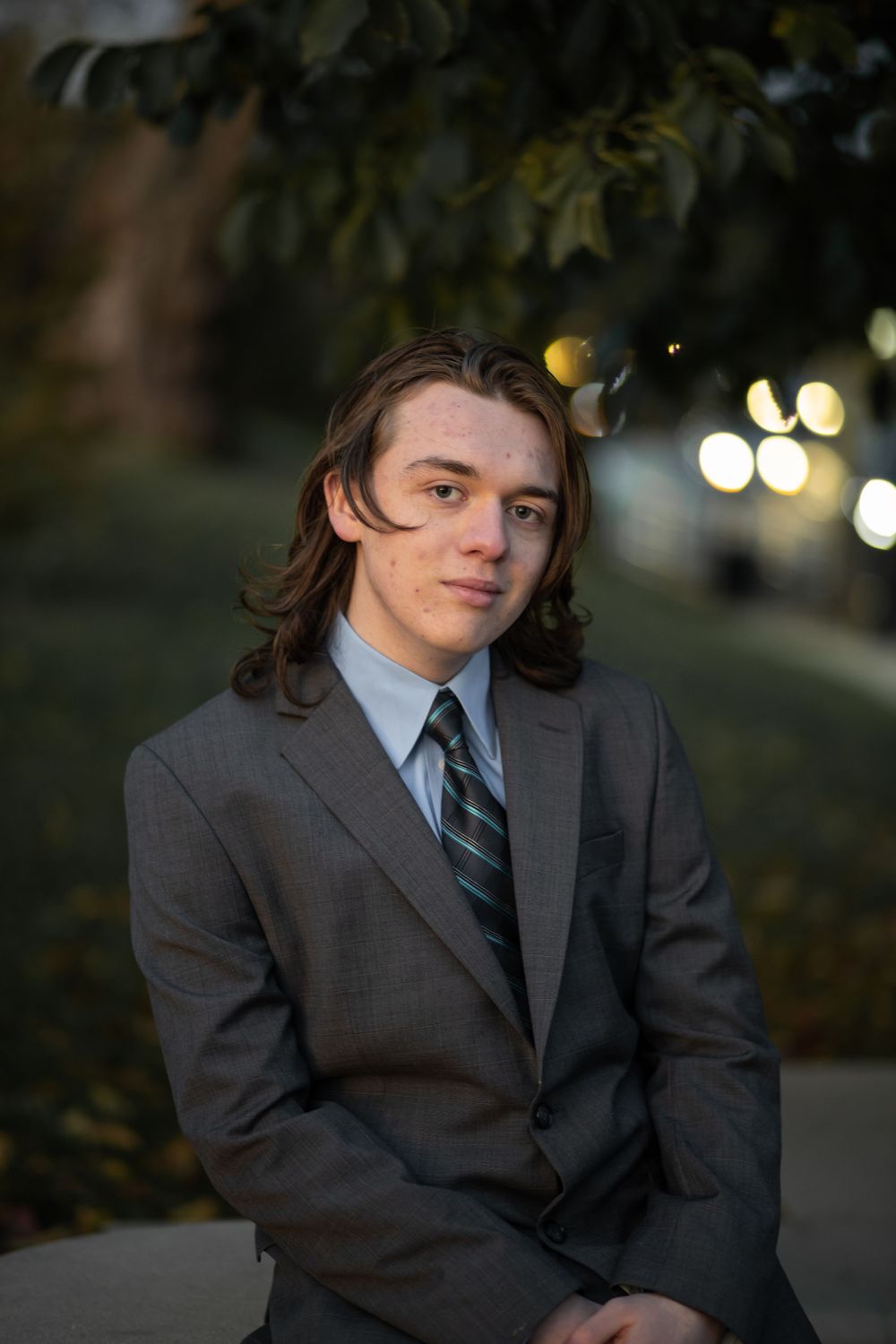 High school senior in a suit sunset photoshoot