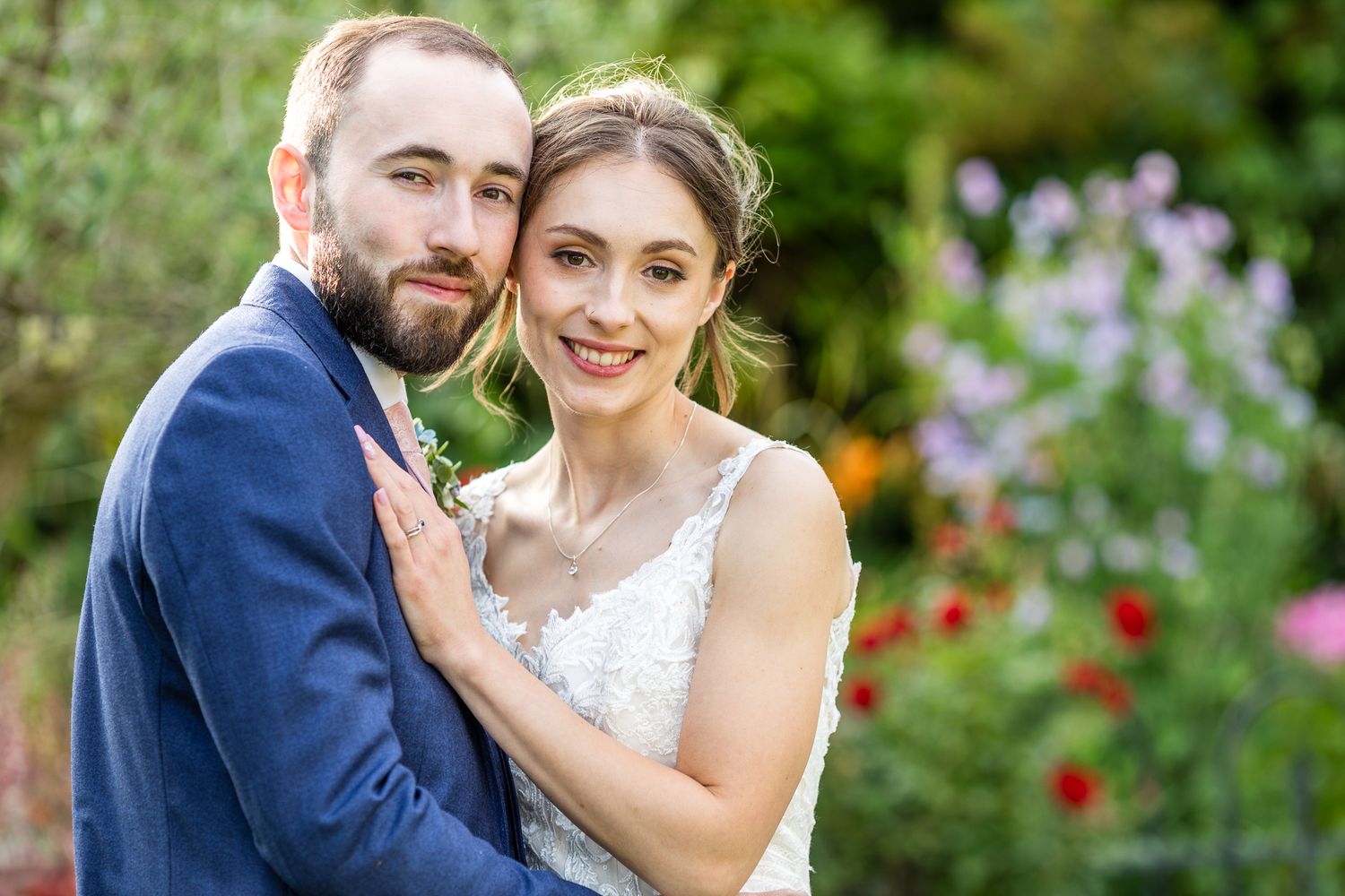 Cooling Castle Barn happy couple posing for wedding photographs