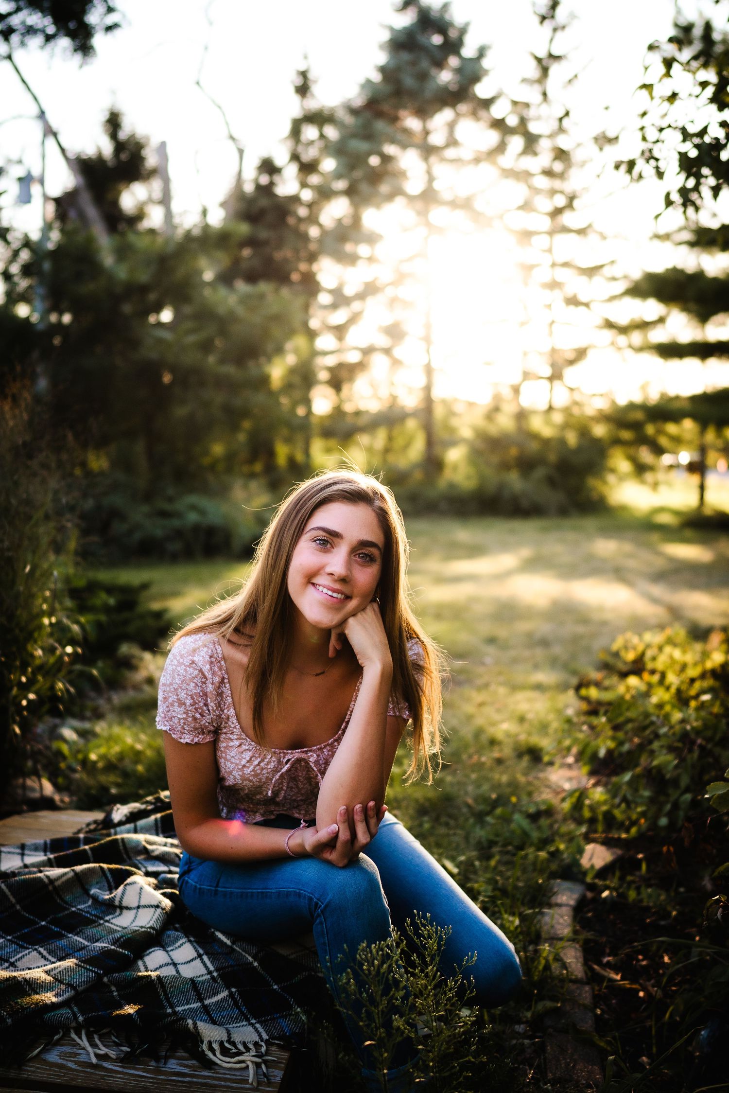 Sunset portrait session in a garden setting with natural golden light.