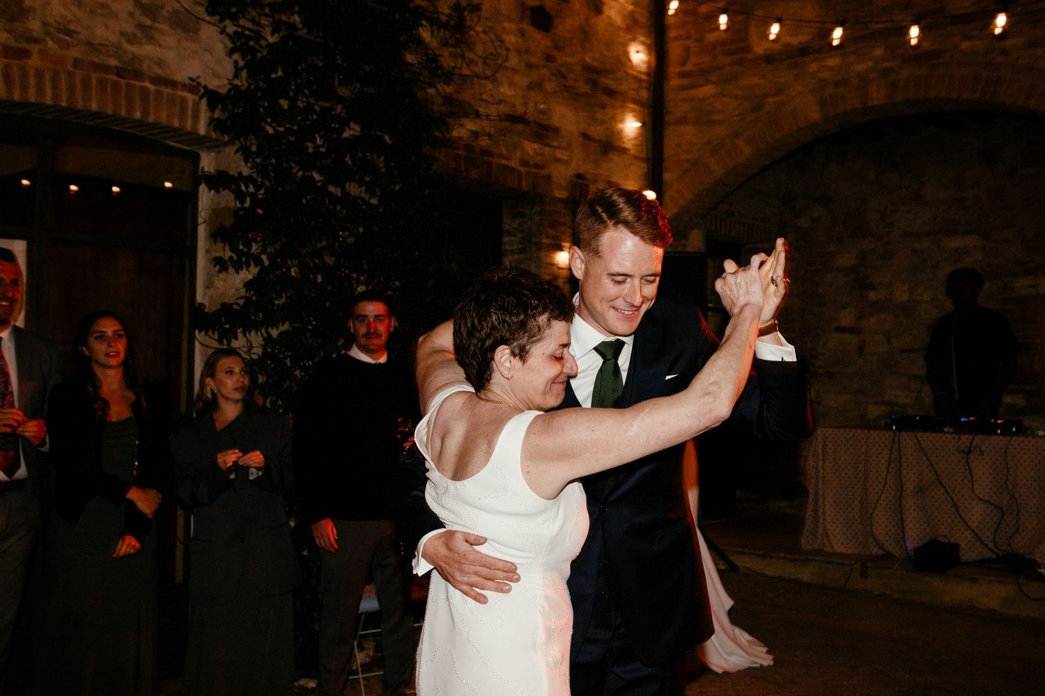 Mother of the groom and son dance.