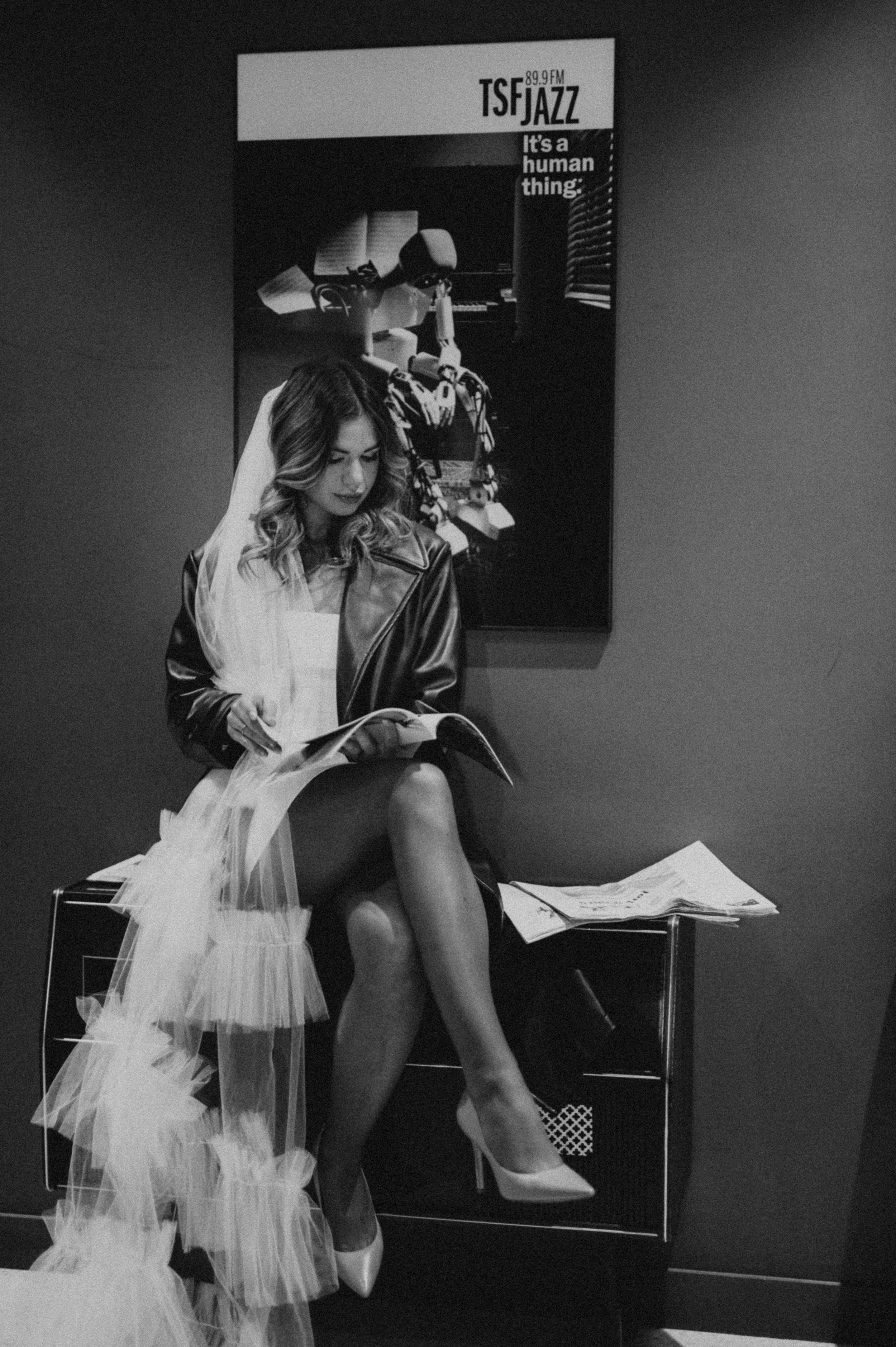 Black and white boudoir photos featuring flowing white tulle fabric and dramatic shadows.