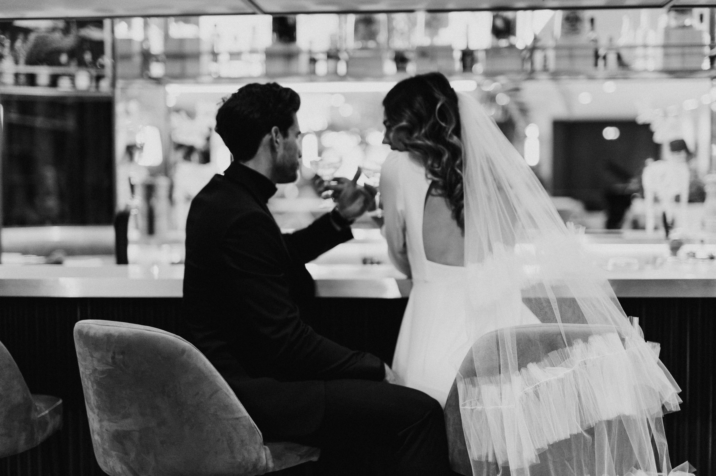 Black and white wedding photography sequence showing couple in tender moments.