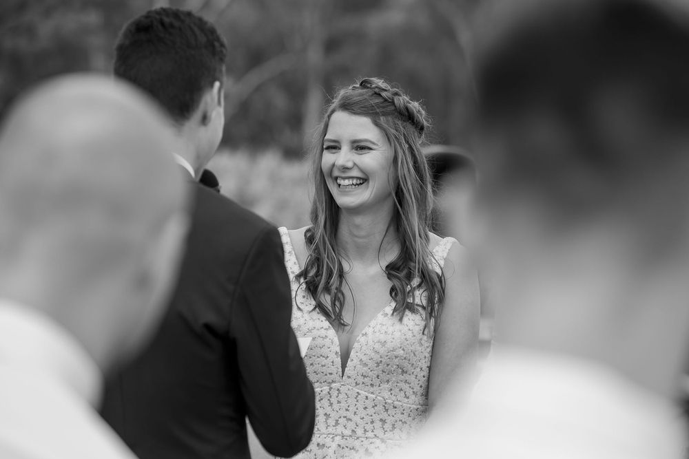 Bride and Groom sharing a moment together as they exchange their vows during their wedding ceremony at St.Leonards