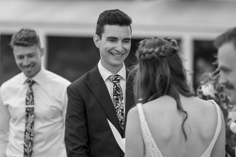 Bride and Groom sharing a moment together as they exchange their vows during their wedding ceremony at St.Leonards
