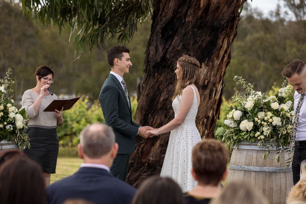Bride and Groom sharing a moment together as they exchange their vows during their wedding ceremony at St.Leonards
