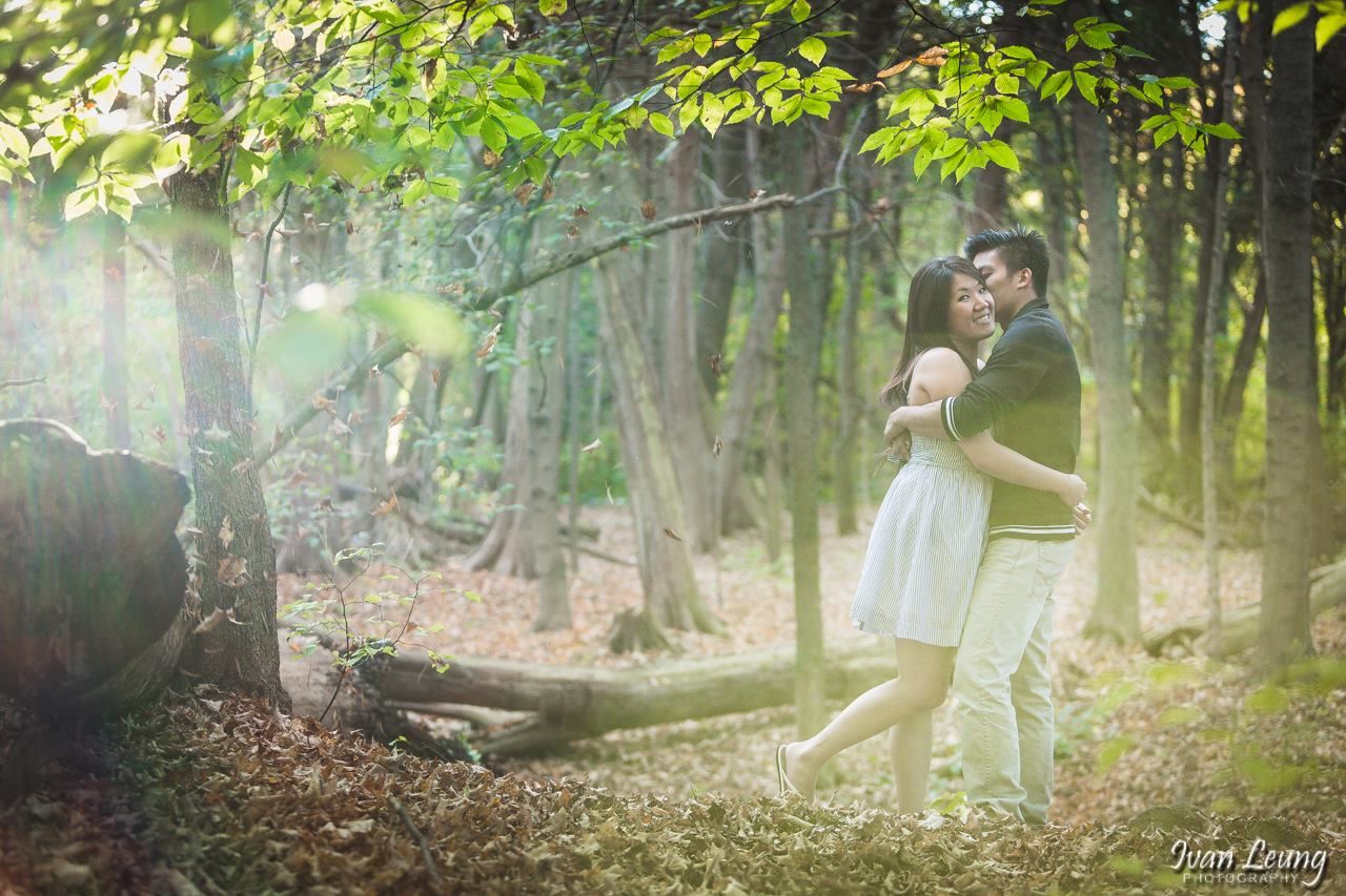 Asian couple posing in a forest at Rouge National Urban Park Woodland Area Scarborough