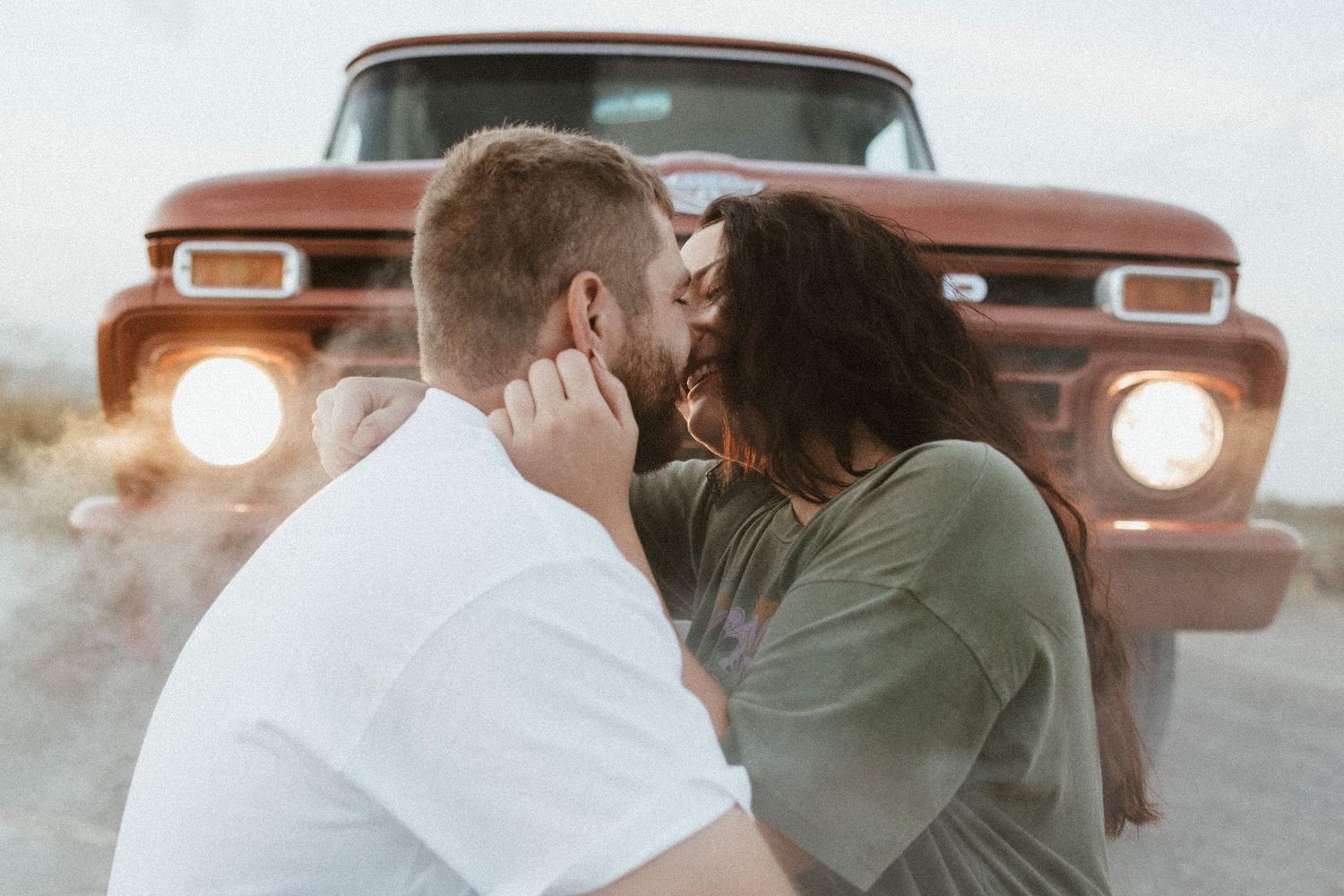 a couple almost kissing in front of a     0:02 / 3:05   1966 Ford 100 Twin I-Beam Classic Pickup Truck
