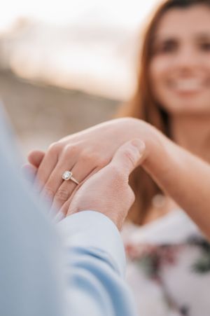 Close up sequence showing a couple's hands and engagement ring.