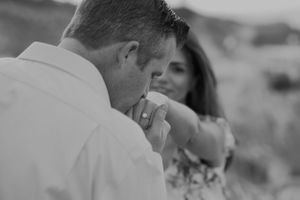 Black and white photo sequence of a couple sharing a tender moment.