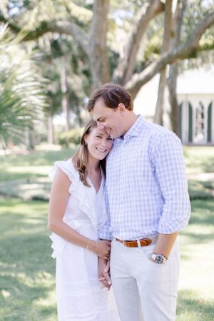 Intimate outdoor portrait with Spanish moss trees in background.