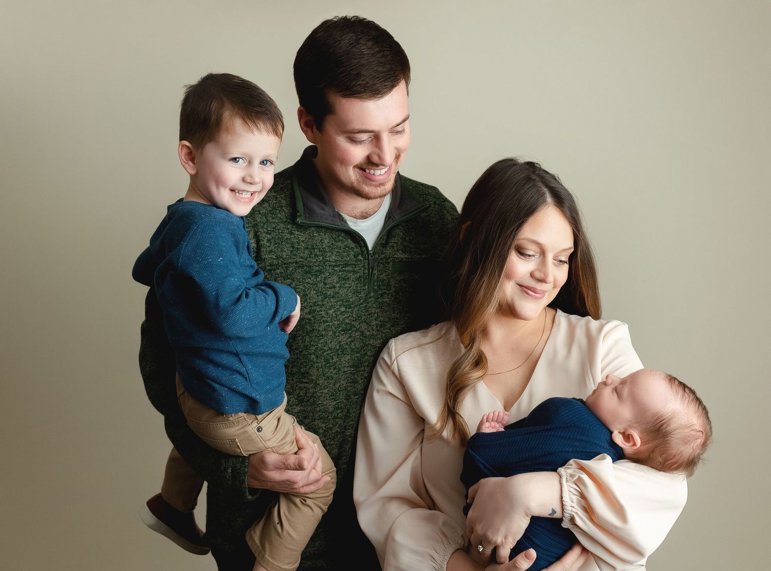A sweet family holding their newborn boy and big brother smiling. Greenville, SC newborn photographer; Easle SC newborn photographer, Upstat