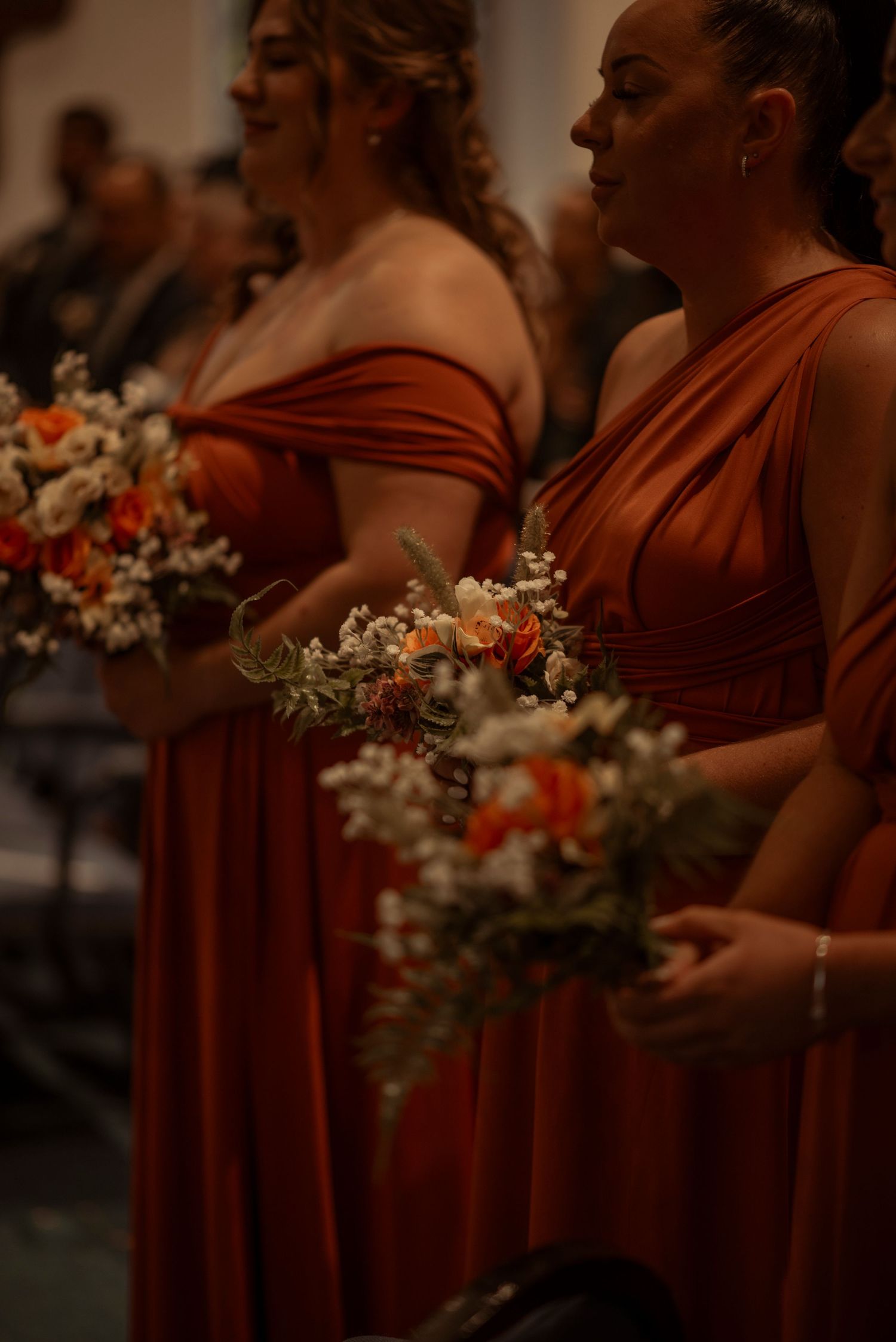 bridesmaids waiting at the end of the isle for the bride