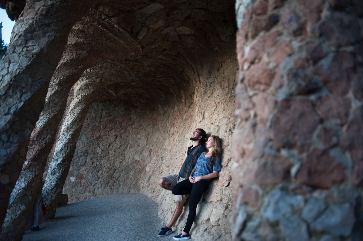 A couple on their photoshoot, take in the architecture of Gaudi in Parc Guell, Barcelona.