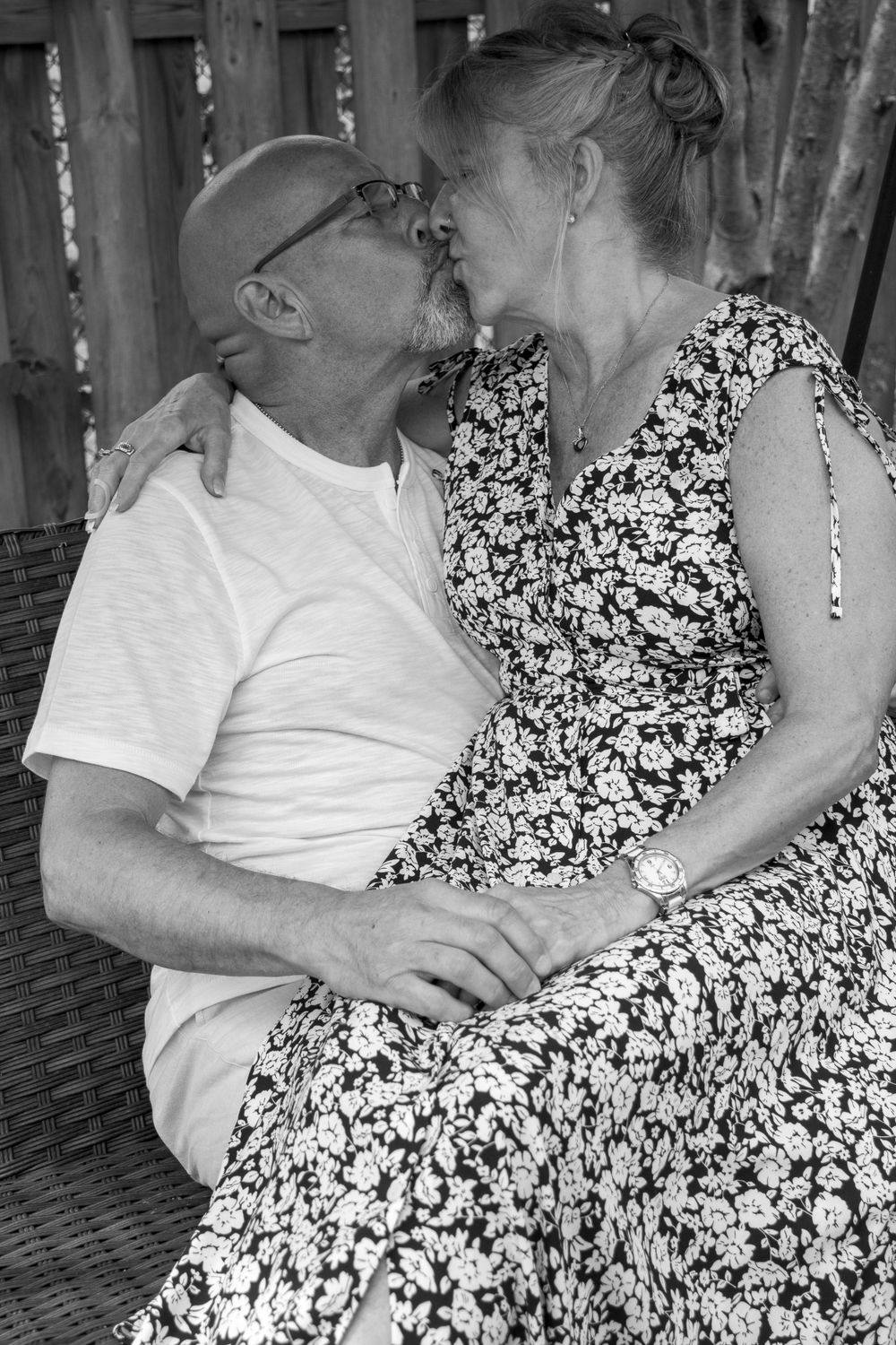 Older bride and groom kissing