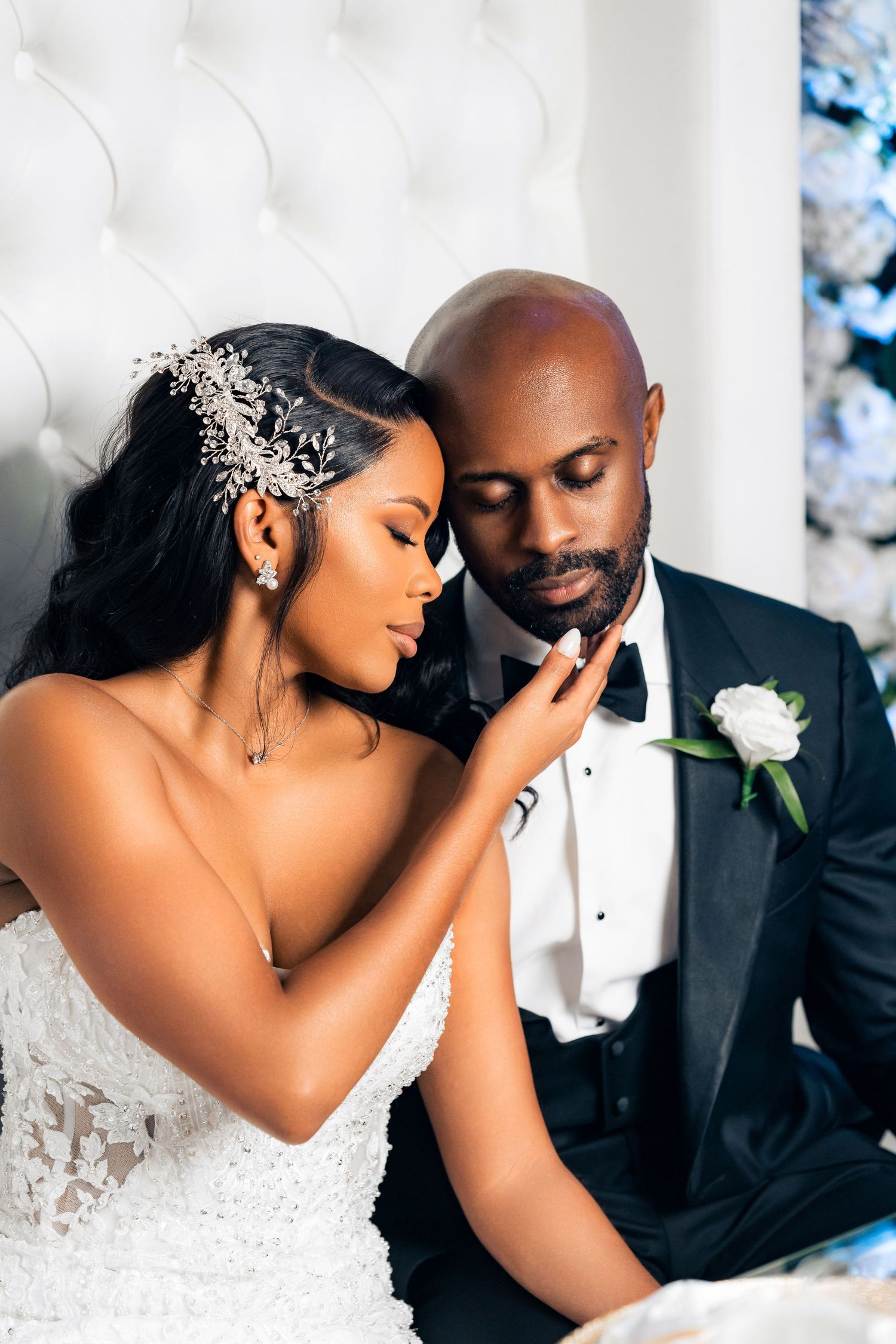 Intimate wedding portrait featuring elegant formal attire and crystal accessories.